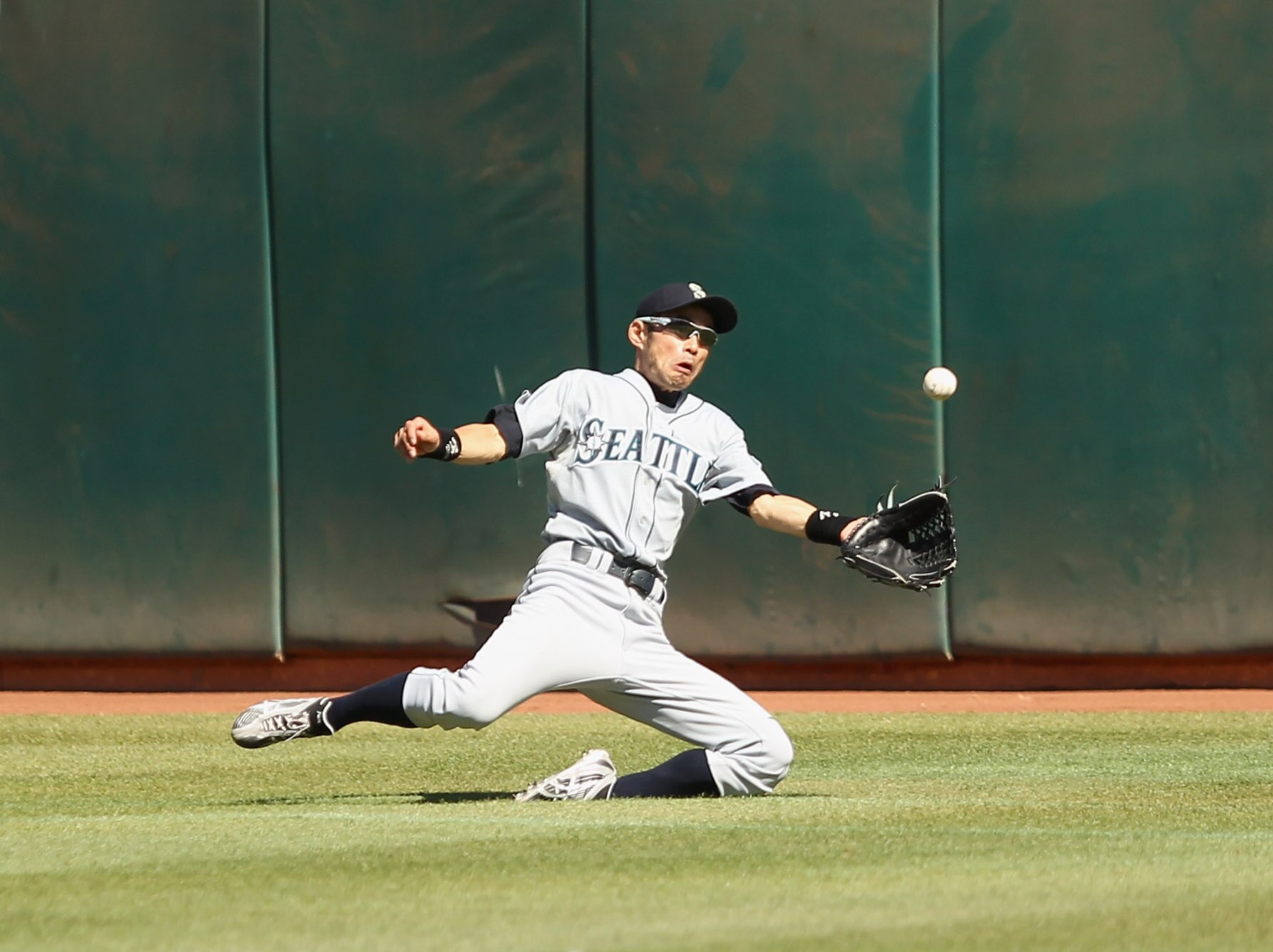 OAKLAND, CA - SEPTEMBER 06:  Ichiro Suzuki #51 of the Seattle Mariners makes a diving catch during their game against the Oakland Athletics at the Oakland-Alameda County Coliseum on September 6, 2010 in Oakland, California.  (Photo by Ezra Shaw/Getty Imag