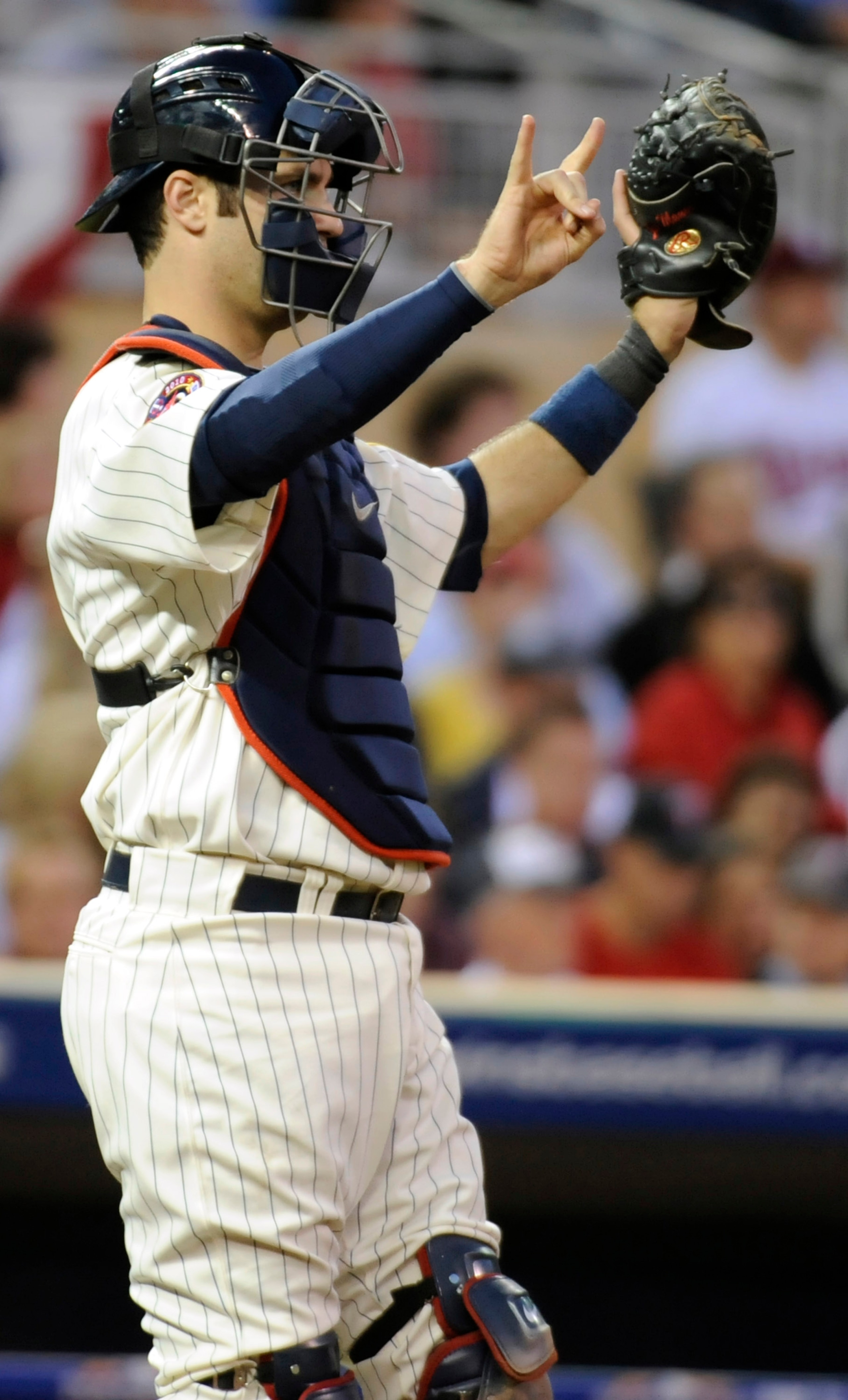 MINNEAPOLIS, MN - OCTOBER 7: Joe Mauer #7 of the Minnesota Twins gives signs during game two of the ALDS game against the New York Yankees on October 7, 2010 at Target Field in Minneapolis, Minnesota.  (Photo by Hannah Foslien/Getty Images)