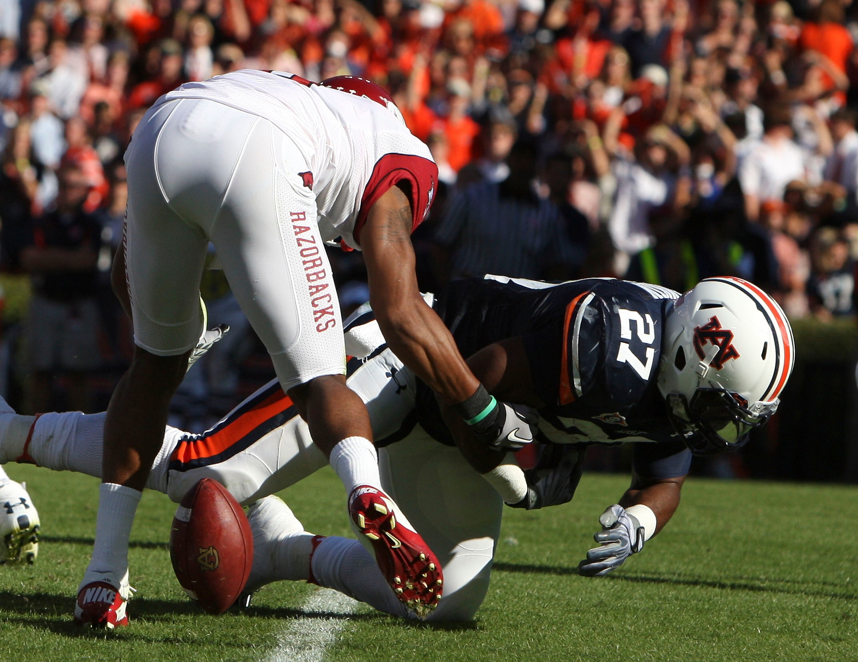 AUBURN - OCTOBER 16:  Running back Mario Fannin #27 of the Auburn Tigers scores a touchdown before fumbling the ball on a play that was reviewed during the game against the Arkansas Razorbacks at Jordan-Hare Stadium on October 16, 2010 in Auburn, Alabama.