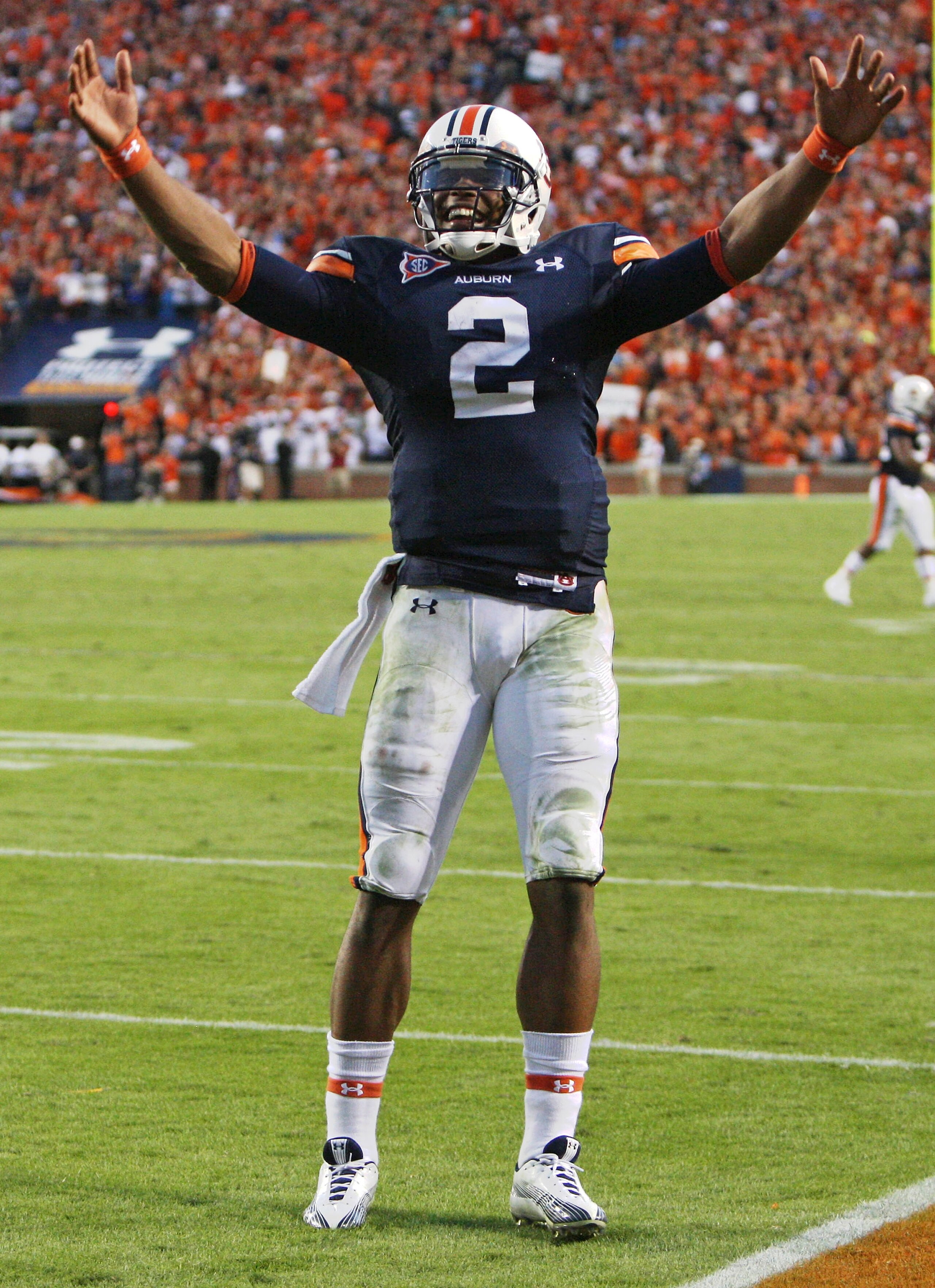 AUBURN - OCTOBER 16:  Quarterback Cam Newton #2 of the Auburn Tigers celebrates during the game against the Arkansas Razorbacks at Jordan-Hare Stadium on October 16, 2010 in Auburn, Alabama.  The Tigers beat the Razorbacks 65-43.  (Photo by Mike Zarrilli/