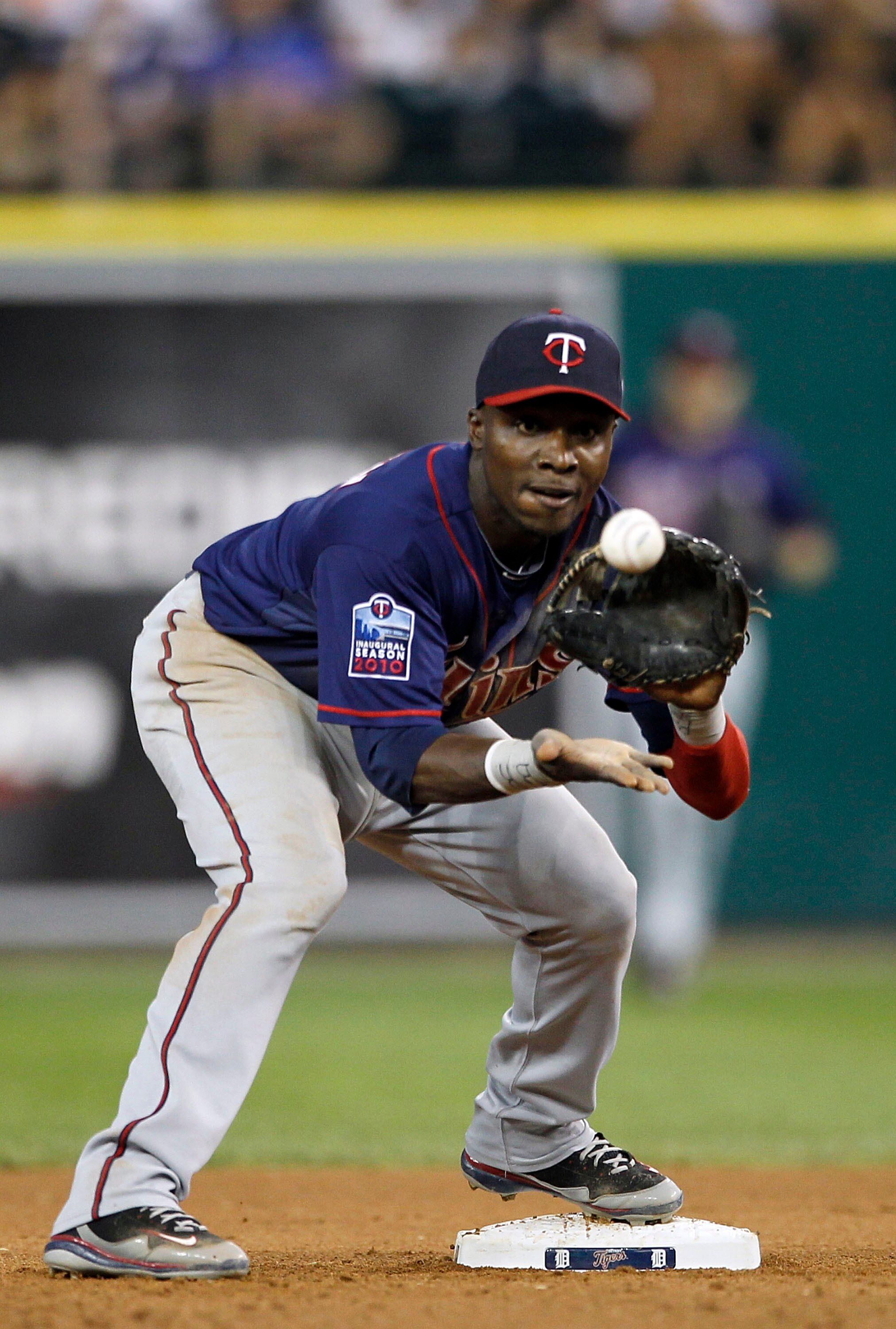 DETROIT - JULY 09: Orlando Hudson #1 of the Minnesota Twins turns the double play during the fifth inning of the game against the Detroit Tigers on July 9, 2010 at Comerica Park in Detroit, Michigan. The Tigers defeated the Twins 7-3.  (Photo by Leon Hali
