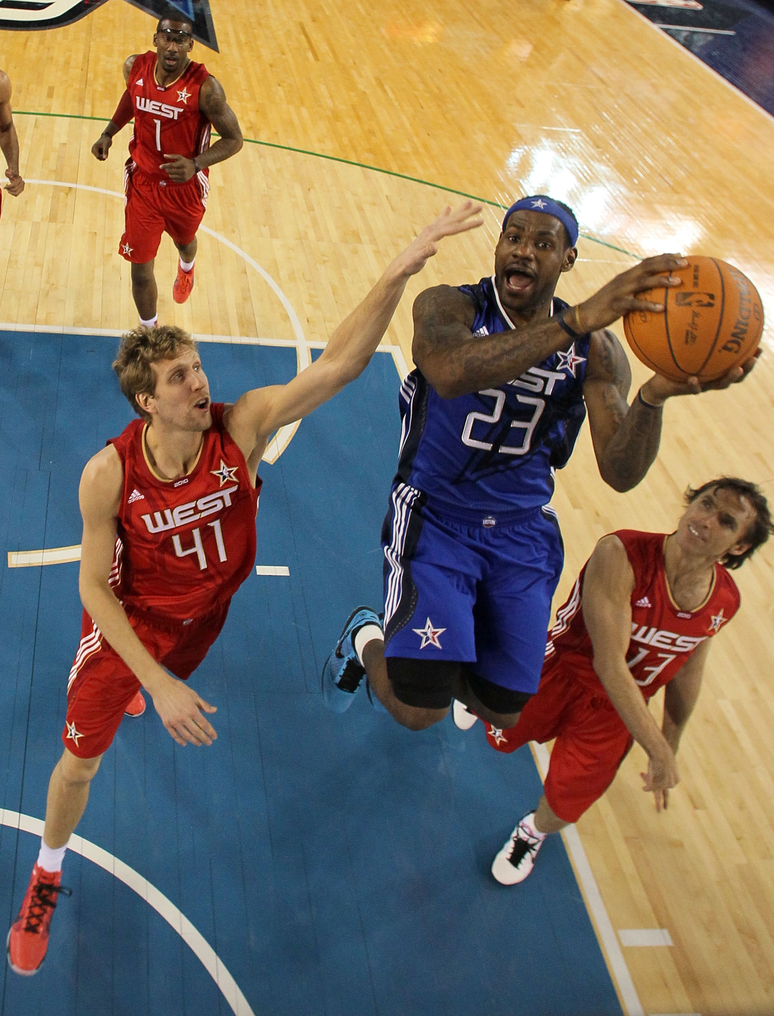 ARLINGTON, TX - FEBRUARY 14:  LeBron James #23 of the Eastern Conference goes up for a dunk against Dirk Notwitzki #41 and Steve Nash #13 of the Western Conference during the second half of the NBA All-Star Game, part of 2010 NBA All-Star Weekend at Cowbo