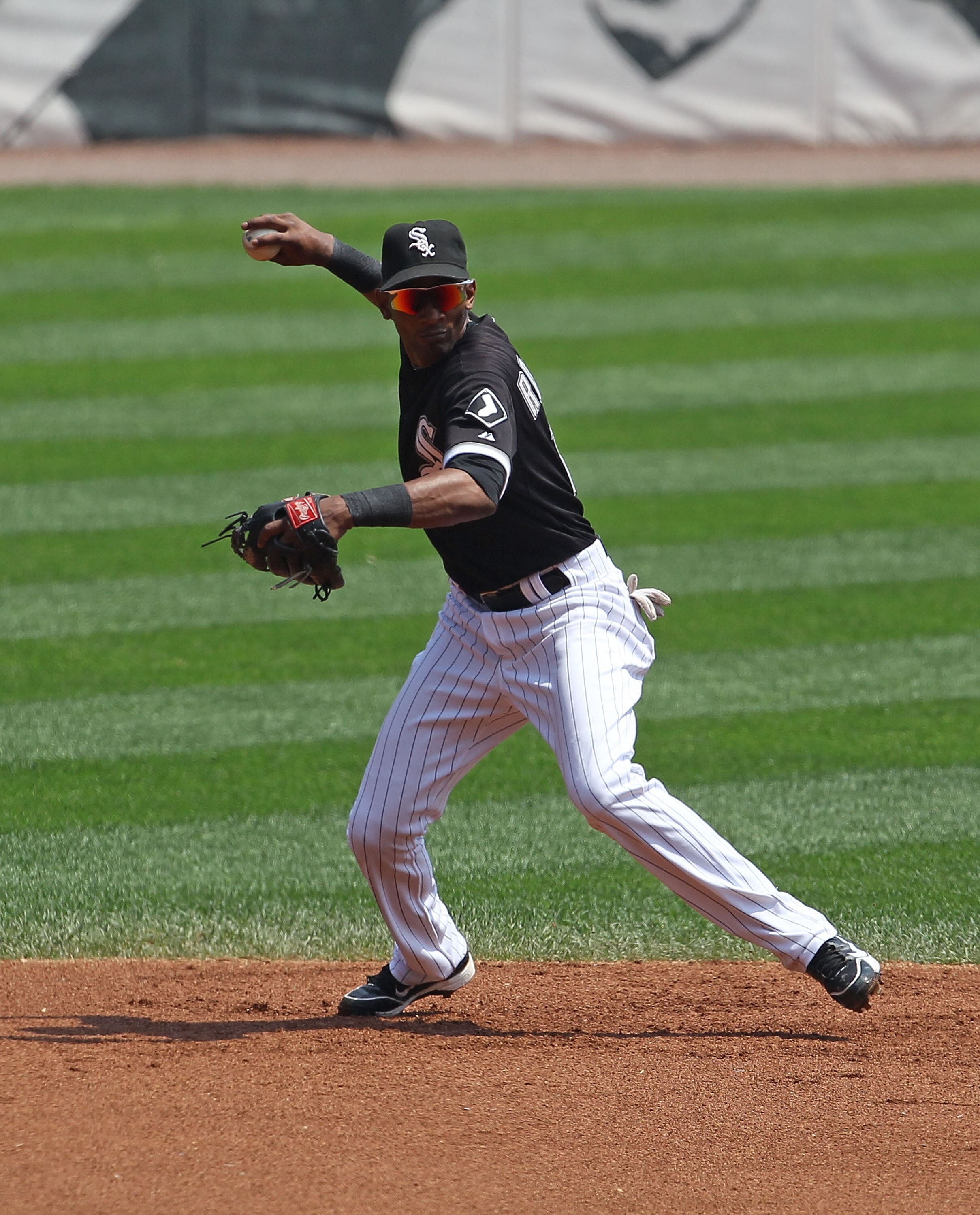 CHICAGO - AUGUST 01: Alexei Ramirez #10 of the Chicago White Sox throws the ball to 1st base against the Oakland Athletics at U.S. Cellular Field on August 1, 2010 in Chicago, Illinois. The White Sox defeated the Athletics 4-1. (Photo by Jonathan Daniel/G