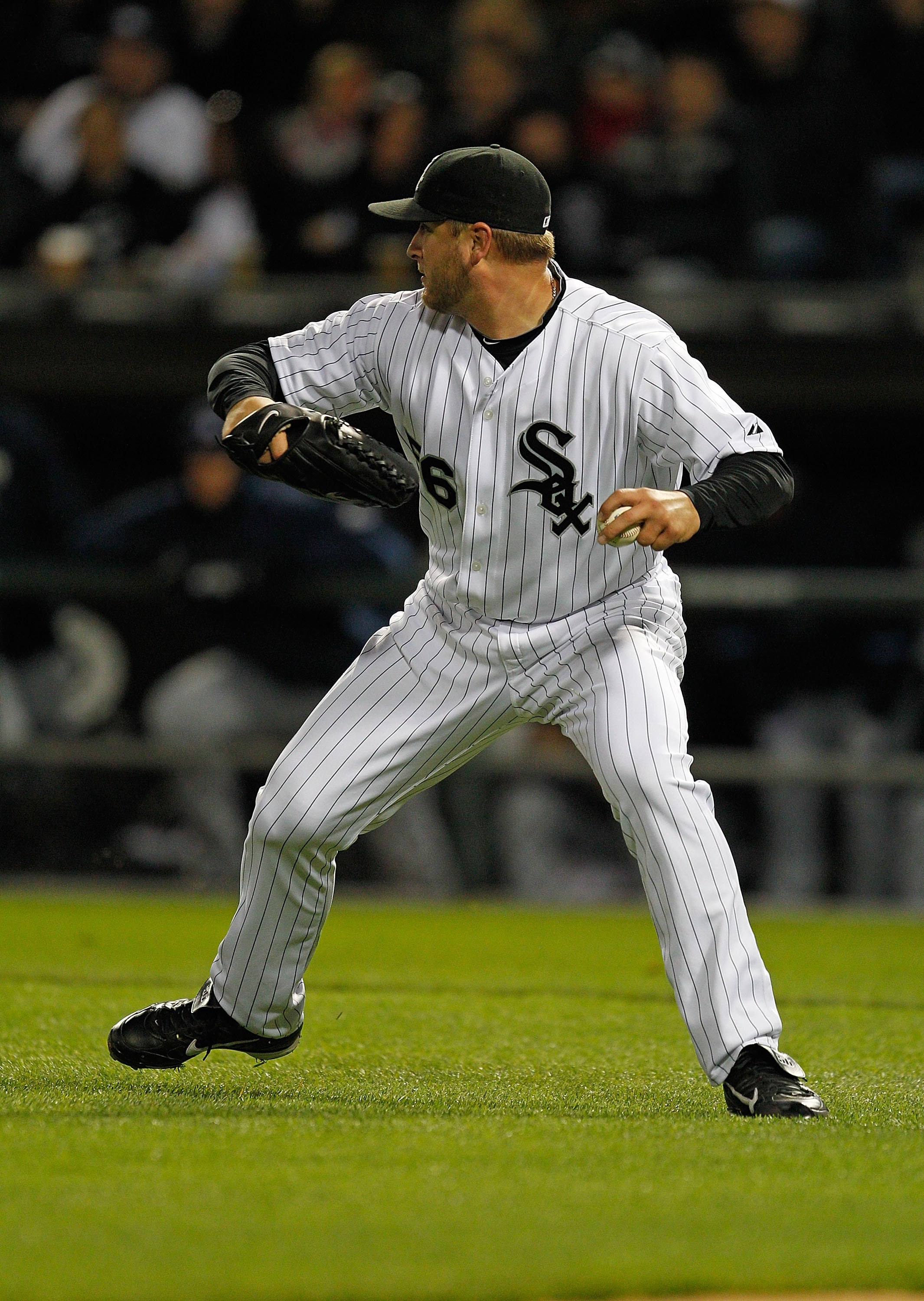 CHICAGO - APRIL 21: Starting pitcher Mark Buehrle #56 of the Chicago White Sox throws to first base against the Tampa Bay Rays at U.S. Cellular Field on April 21, 2010 in Chicago, Illinois. The Rays defeated the White Sox 12-0. (Photo by Jonathan Daniel/G