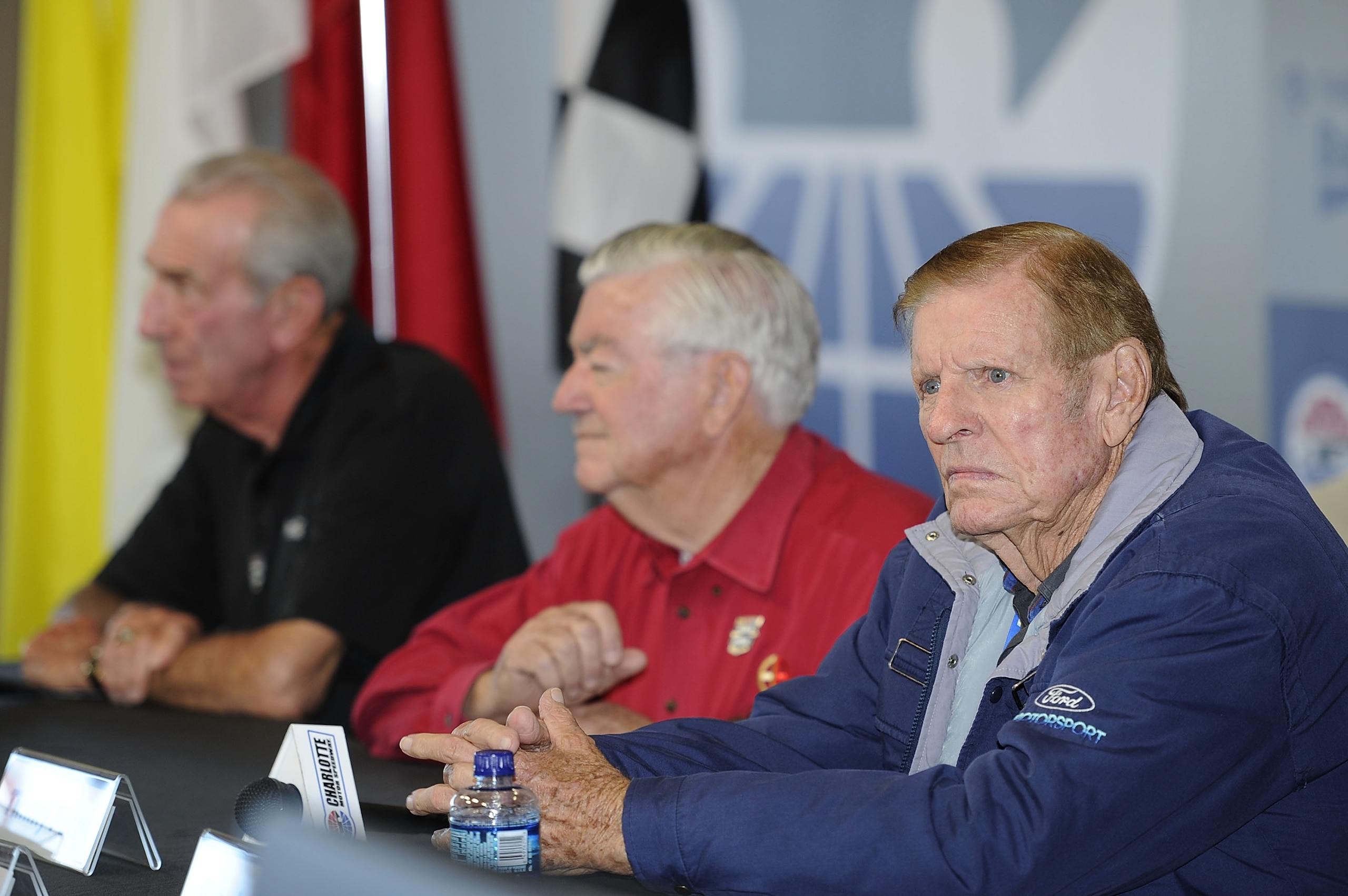 CONCORD, NC - OCTOBER 16: NASCAR Past Champions Bud Moore (R), Bobby Allison (C), and Ned Jarrett (L) speak to the media prior to the NASCAR Sprint Cup Series Bank of America 500 at Charlotte Motor Speedway on October 16, 2010 in Concord, North Carolina. CONCORD, NC - OCTOBER 16: NASCAR Past Champions Bud Moore (R), Bobby Allison (C), and Ned Jarrett (L) speak to the media prior to the NASCAR Sprint Cup Series Bank of America 500 at Charlotte Motor Speedway on October 16, 2010 in Concord, North Carolina.