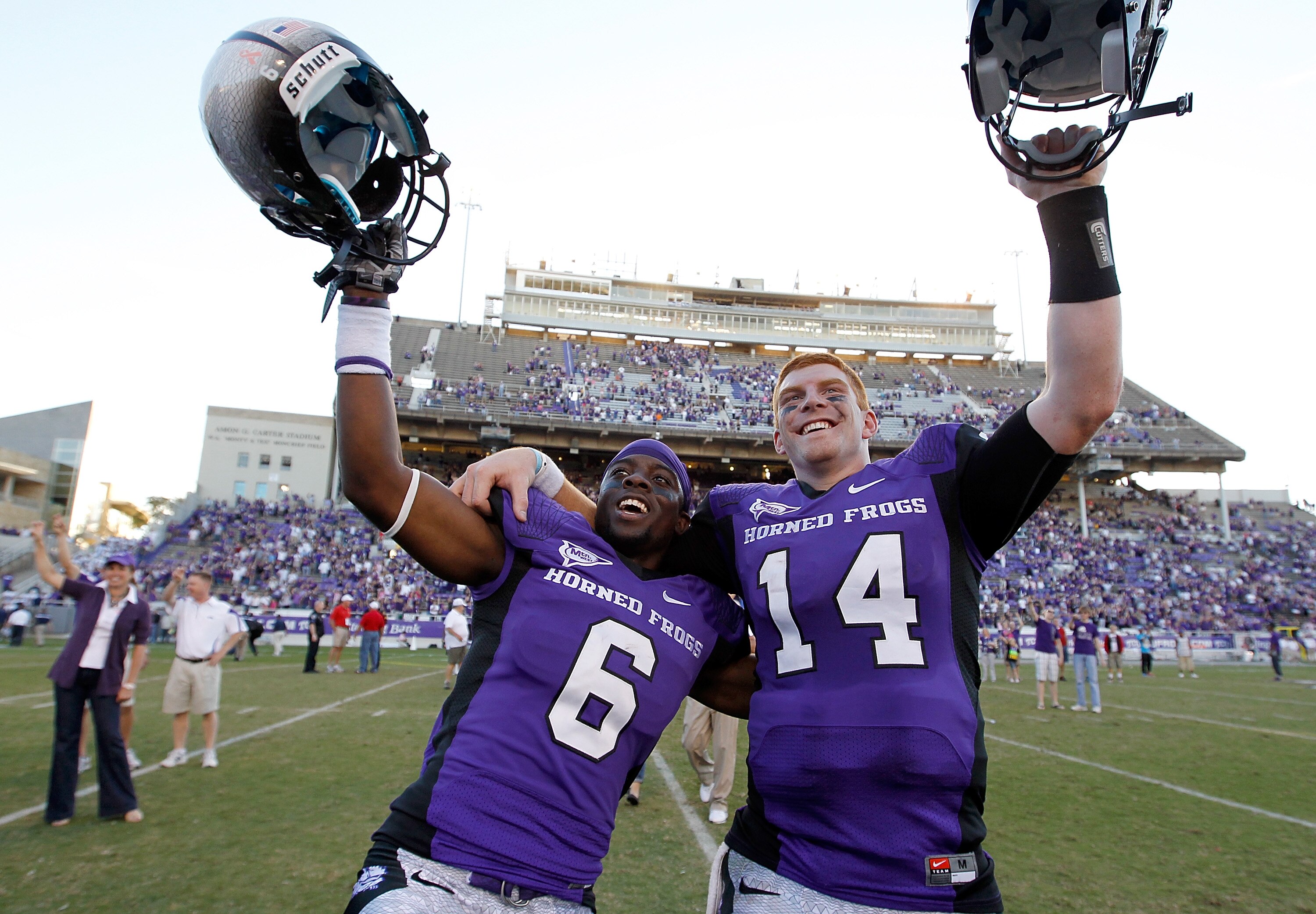 FORT WORTH, TX - OCTOBER 16:  Cornerback Elisha Olabode #6 of the TCU Horned Frogs celebrates with starting quarterback Andy Dalton #14 after TCU beat the BYU Cougars 31-3 at Amon G. Carter Stadium on October 16, 2010 in Fort Worth, Texas.  (Photo by Tom