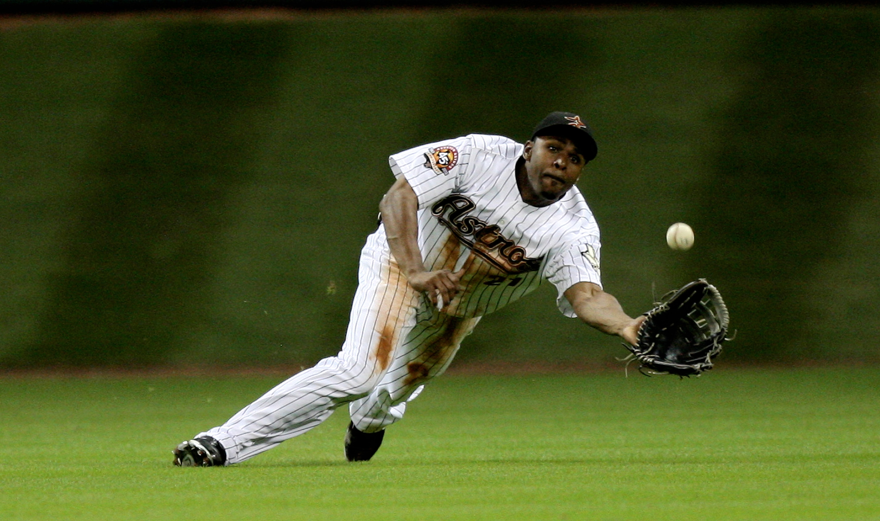 HOUSTON - JULY 30:  Center fielder Michael Bourn #21 of the Houston Astros makes a diving catch on a ball hit by Prince Fielder of the Milwaukee Brewers in the eighth inning at Minute Maid Park on July 30, 2010 in Houston, Texas.  (Photo by Bob Levey/Gett