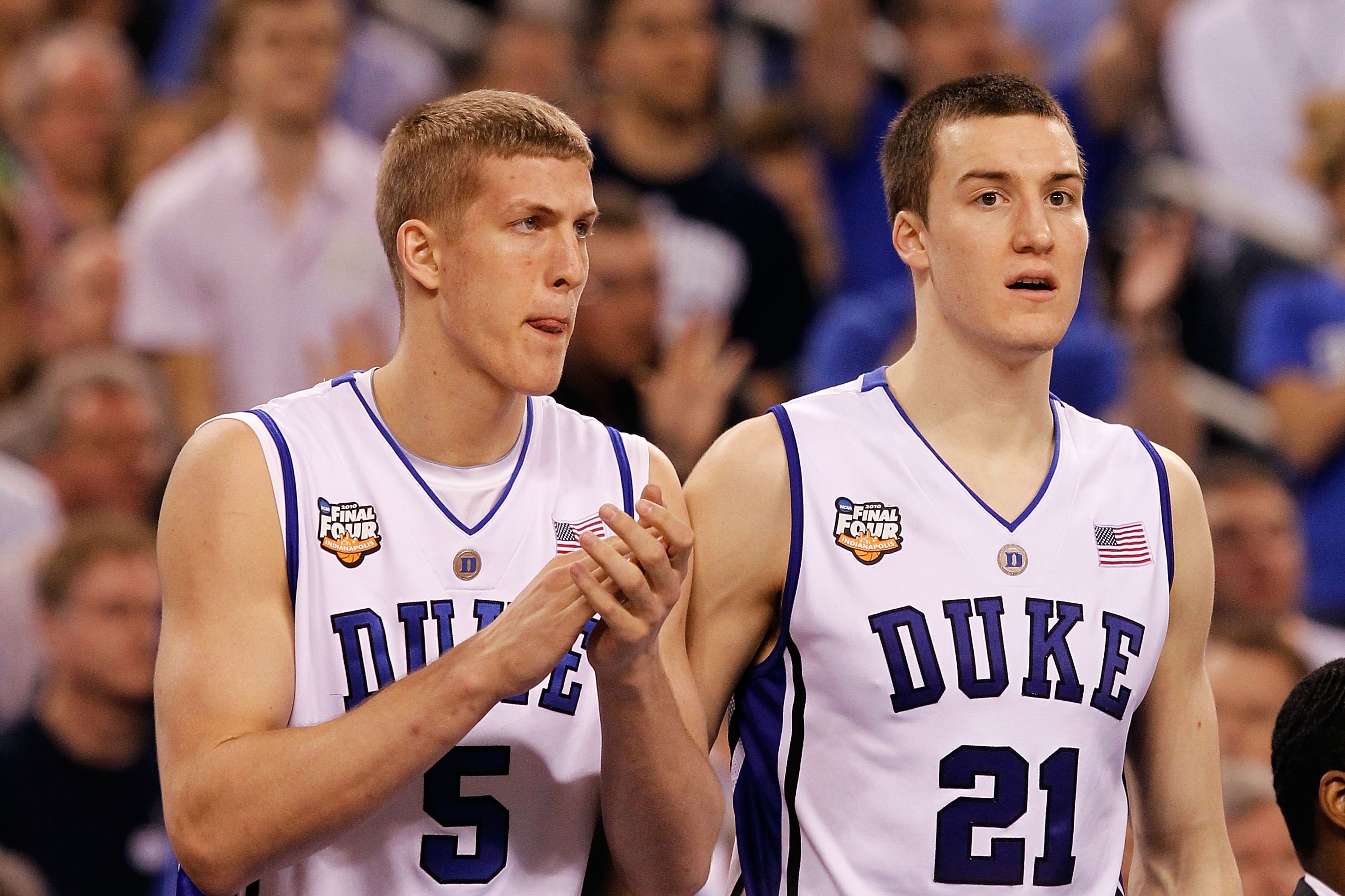 INDIANAPOLIS - APRIL 05:  Mason Plumlee #5 and Miles Plumlee #21 of the Duke Blue Devils support their teamates from the bench against the Butler Bulldogs during the 2010 NCAA Division I Men's Basketball National Championship game at Lucas Oil Stadium on 