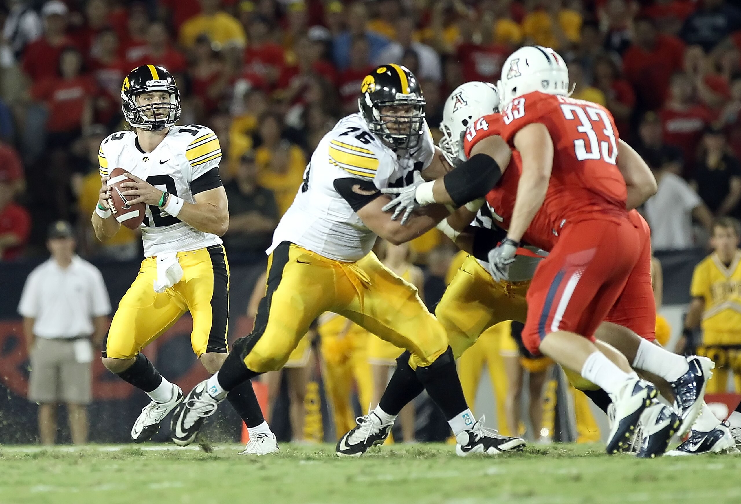 TUCSON, AZ - SEPTEMBER 18:  Quarterback Ricky Stanzi #12 of the Iowa Hawkeyes drops back to pass during the college football game against the Arizona Wildcats at Arizona Stadium on September 18, 2010 in Tucson, Arizona.  The Wildcats defeated the Hawkeyes