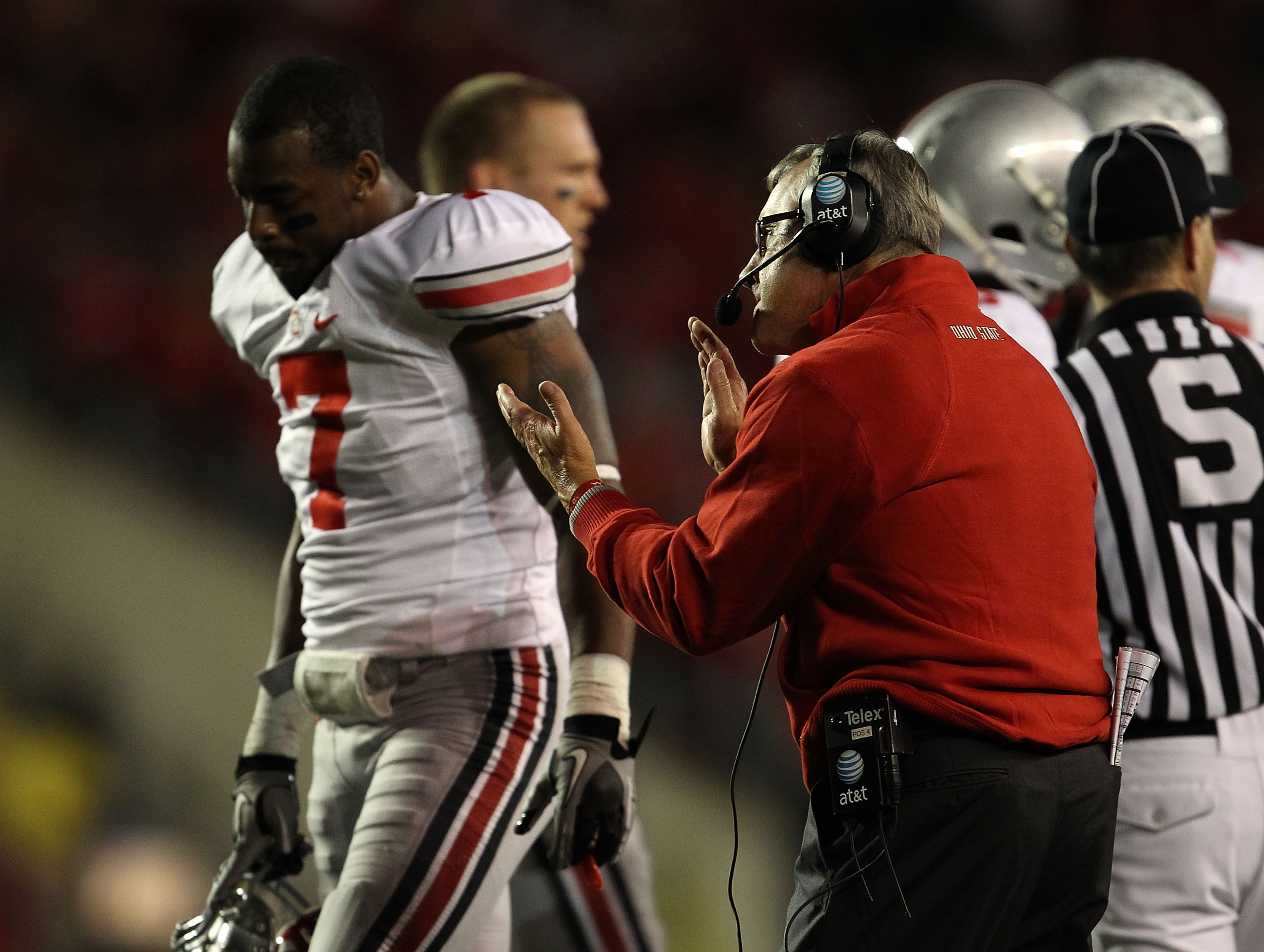 MADISON, WI - OCTOBER 16: Head coach Jim Tressel of the Ohio State Buckeyes tries to encourage his team including Jermale Hines #7 against the Wisconsin Badgers at Camp Randall Stadium on October 16, 2010 in Madison, Wisconsin. (Photo by Jonathan Daniel/G