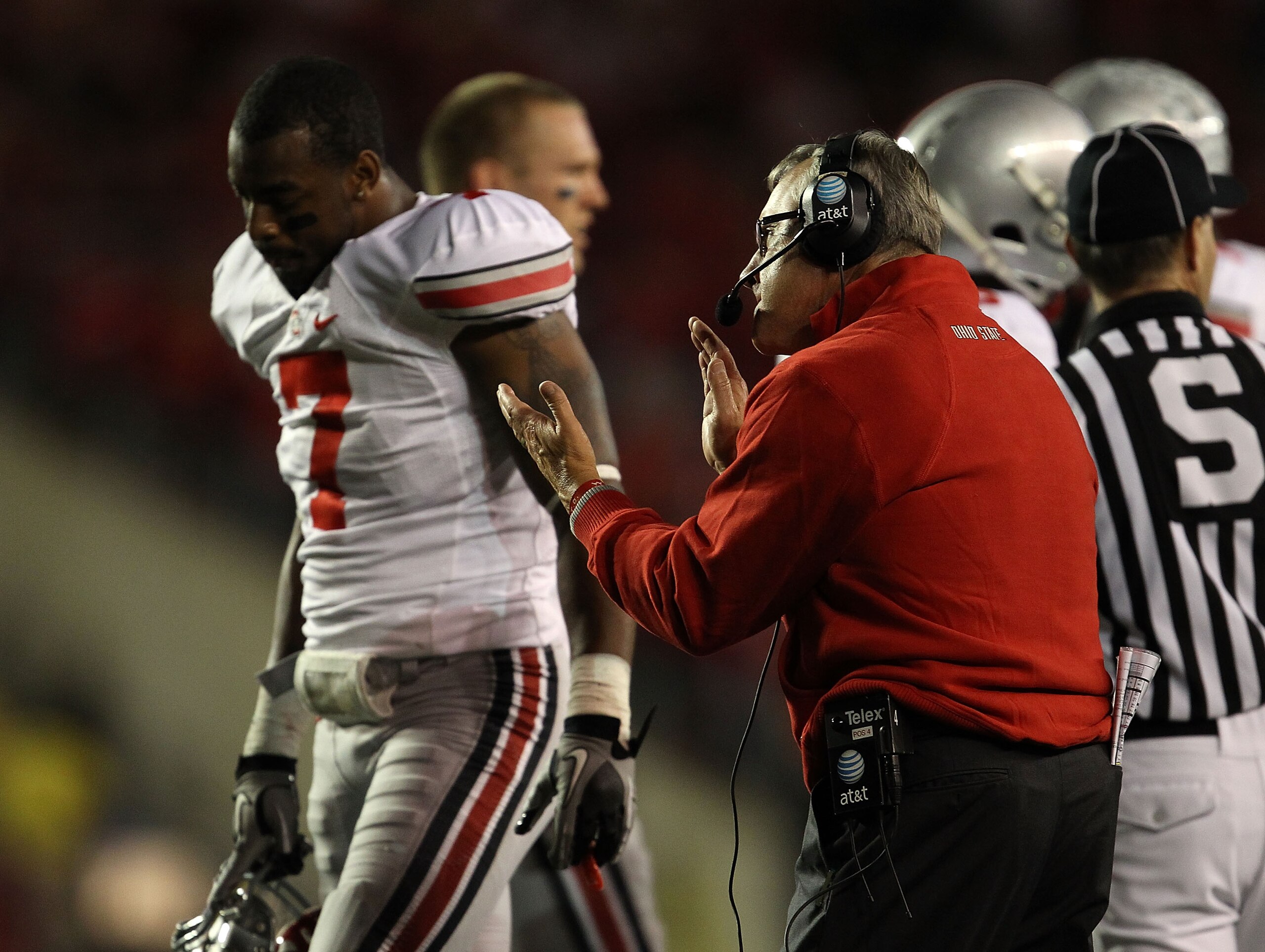 MADISON, WI - OCTOBER 16: Head coach Jim Tressel of the Ohio State Buckeyes tries to encourage his team including Jermale Hines #7 against the Wisconsin Badgers at Camp Randall Stadium on October 16, 2010 in Madison, Wisconsin. (Photo by Jonathan Daniel/G