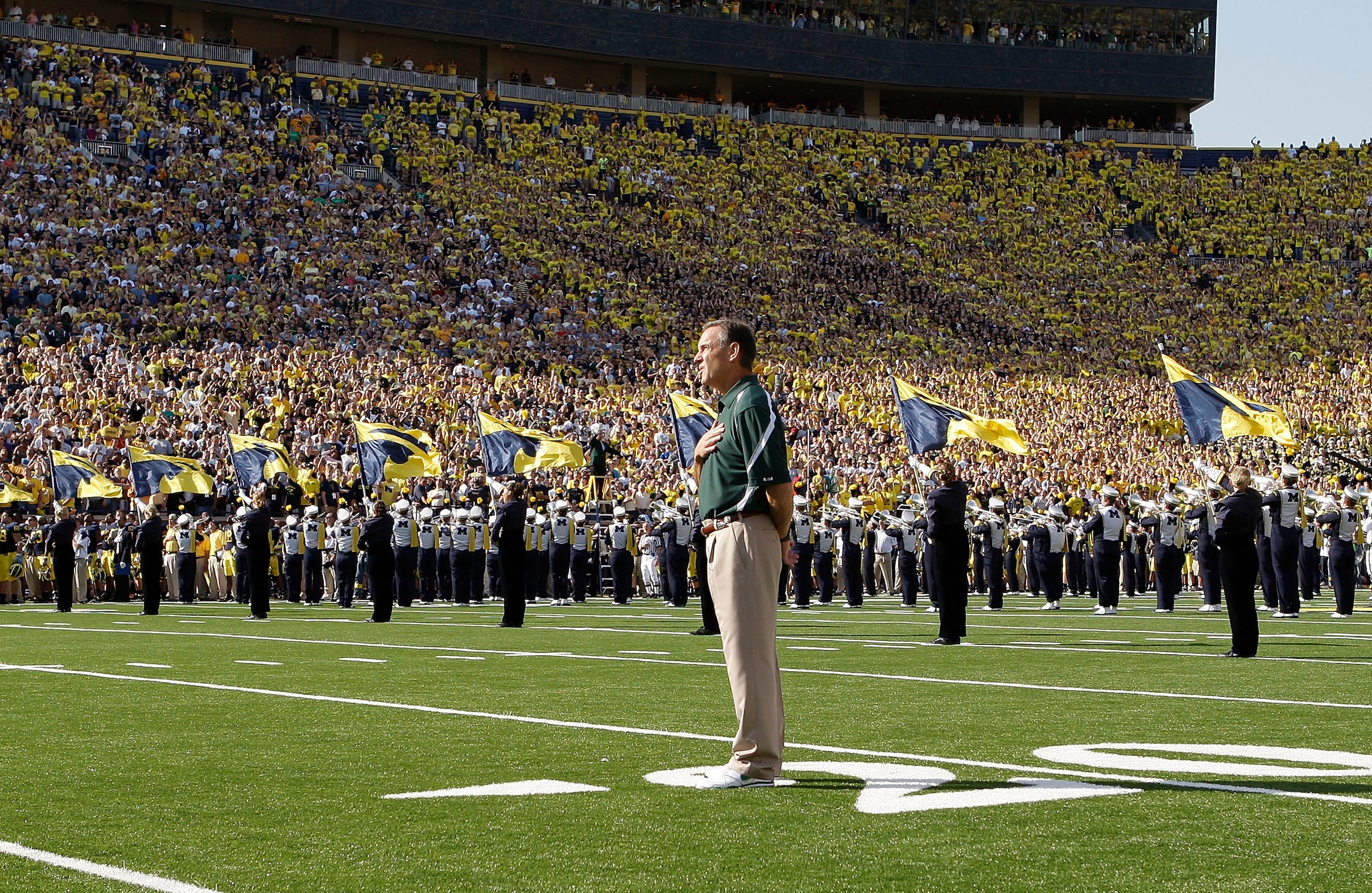 ANN ARBOR, MI - OCTOBER 09:  Michigan State head coach Mark Dantonio stands on the field for the National Anthem prior to the start of the game against the Michigan Wolverines October 9, 2010 at Michigan Stadium in Ann Arbor, Michigan. The Spartans defeat