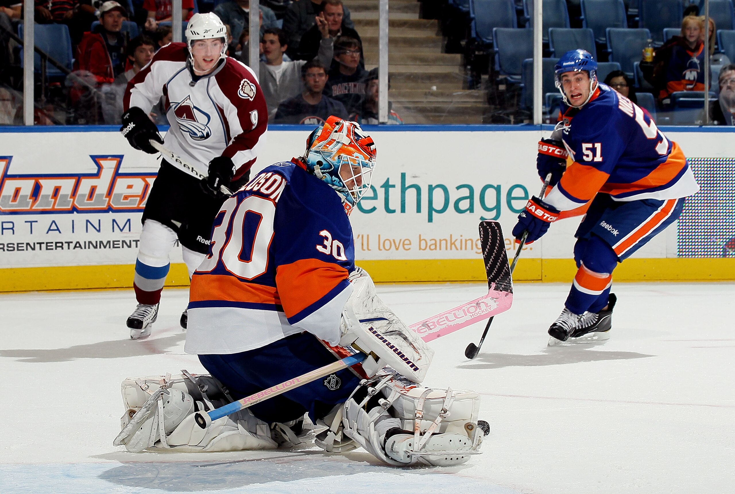 UNIONDALE, NY - OCTOBER 16:  Dwayne Roloson #30 of the New York Islanders makes a save against the Colorado Avalanche on October 16, 2010 at Nassau Coliseum in Uniondale, New York. The Isles defeated the Avalanche 5-2.  (Photo by Jim McIsaac/Getty Images)