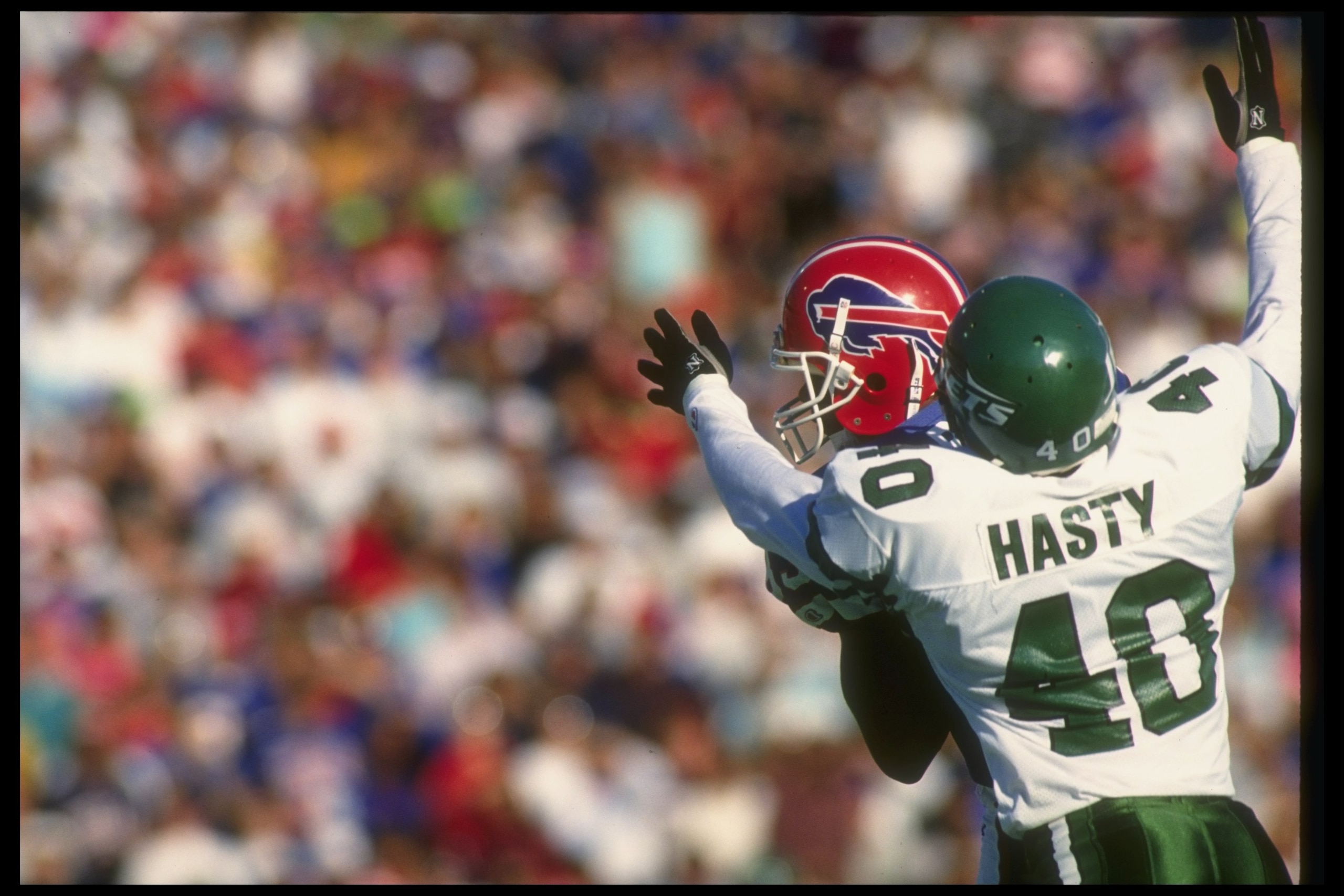 21 Oct 1990:  Defensive back James Hasty of the New York Jets tackles Buffalo Bills wide receiver Andre Reed during a game at Rich Stadium in Orchard Park, New York.  The Bills won the game, 30-27. Mandatory Credit: Rick Stewart  /Allsport