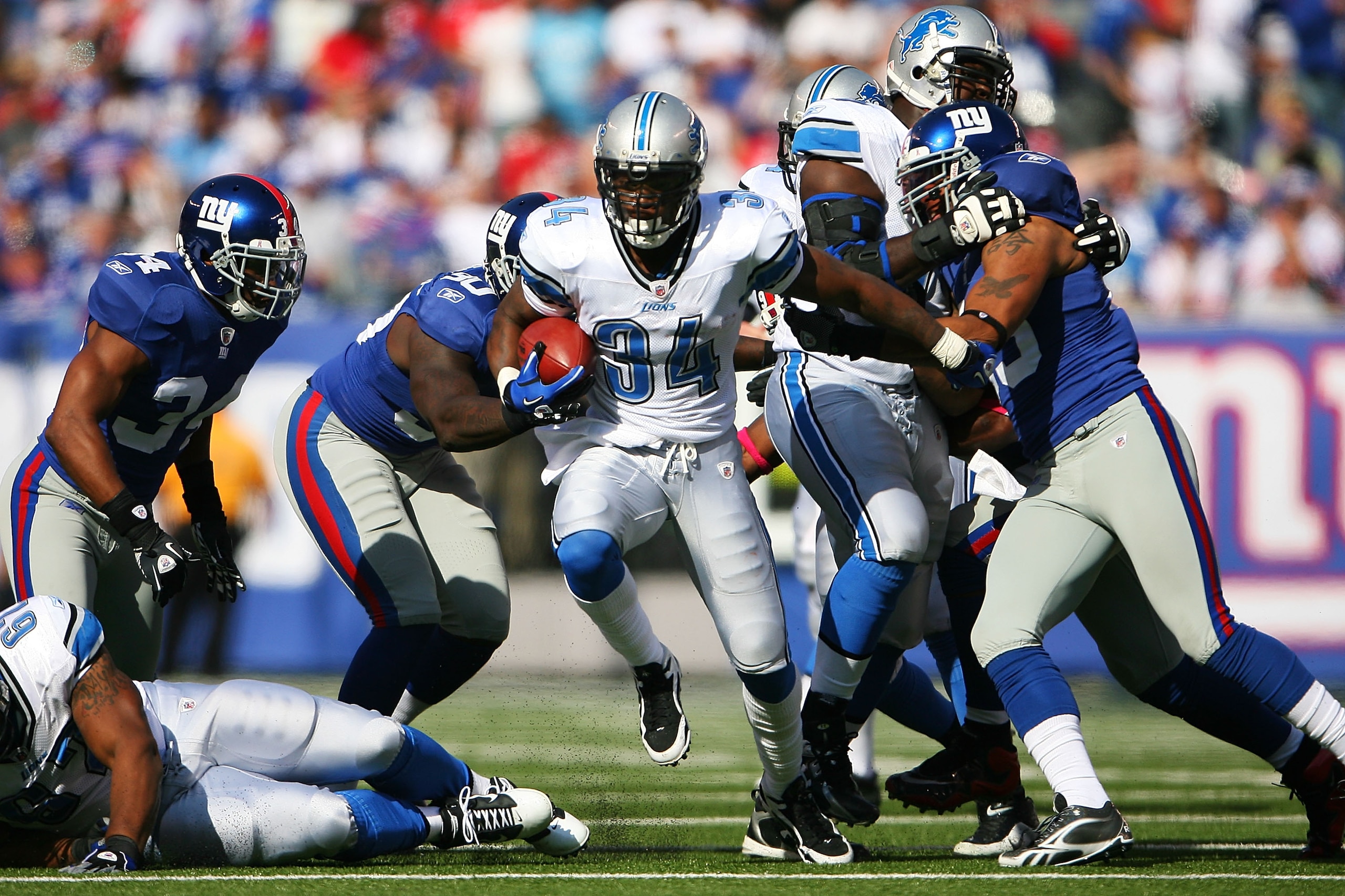 EAST RUTHERFORD, NJ - OCTOBER 17: Kevin Smith #34 of the Detroit Lions runs the ball against the New York Giants at New Meadowlands Stadium on October 17, 2010 in East Rutherford, New Jersey. The Giants defeated the Lions 28 - 20. (Photo by Andrew Burton/