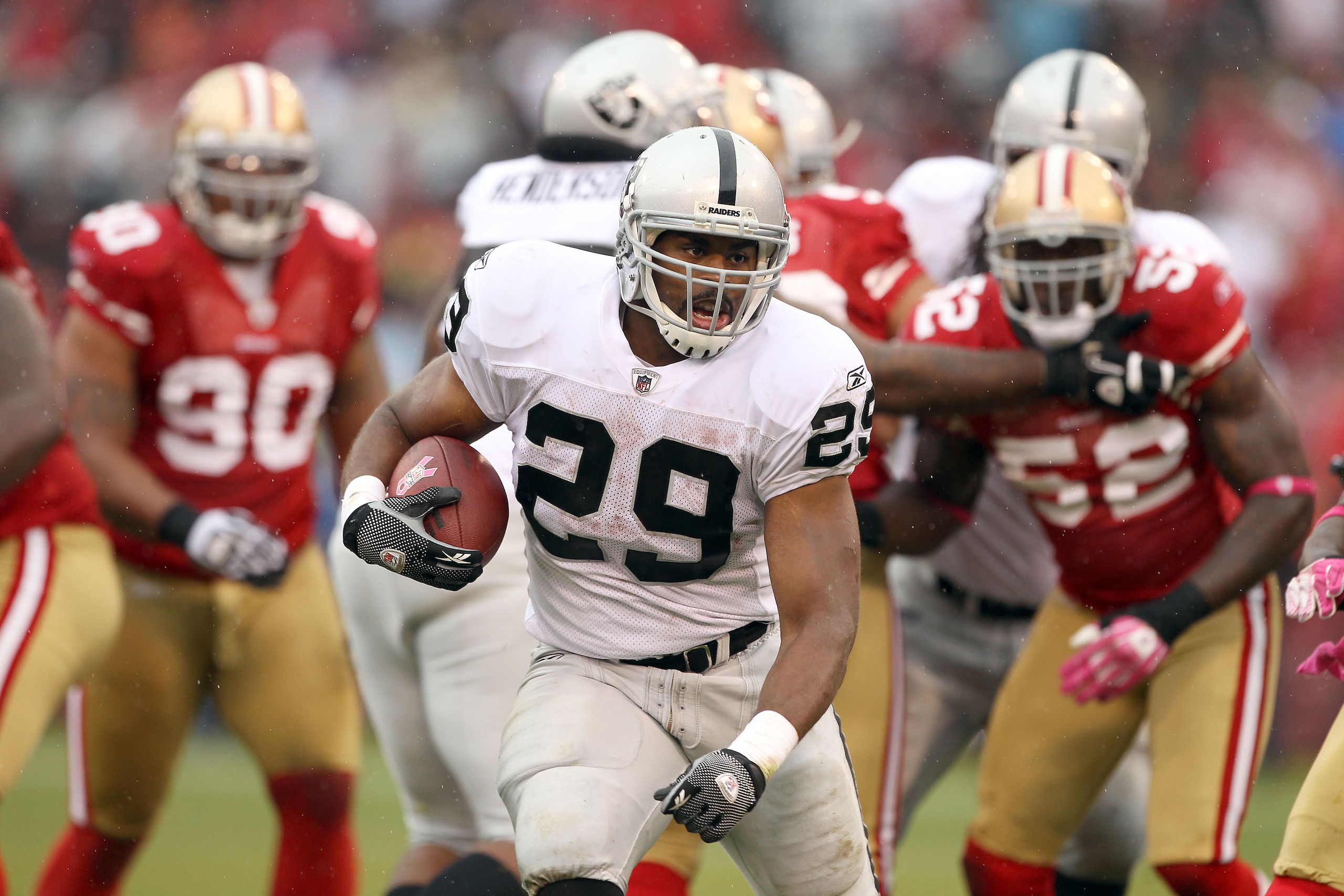 SAN FRANCISCO - OCTOBER 17:  Micahel Bush #29 of the Oakland Raiders runs with the ball against the San Francisco 49ers at Candlestick Park on October 17, 2010 in San Francisco, California.  (Photo by Ezra Shaw/Getty Images)