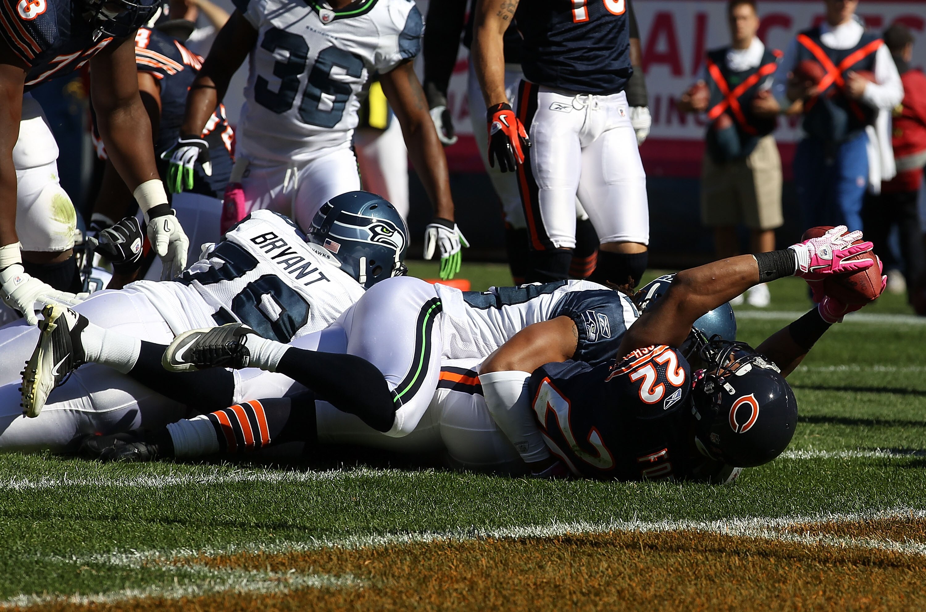 CHICAGO - OCTOBER 17: Matt Forte #22 of the Chicago Bears scores a touchdown as he is tackled by Earl Thomas #29 of the Seattle Seahawks at Soldier Field on October 17, 2010 in Chicago, Illinois. The Seahawks defeated the Bears 23-20. (Photo by Jonathan D