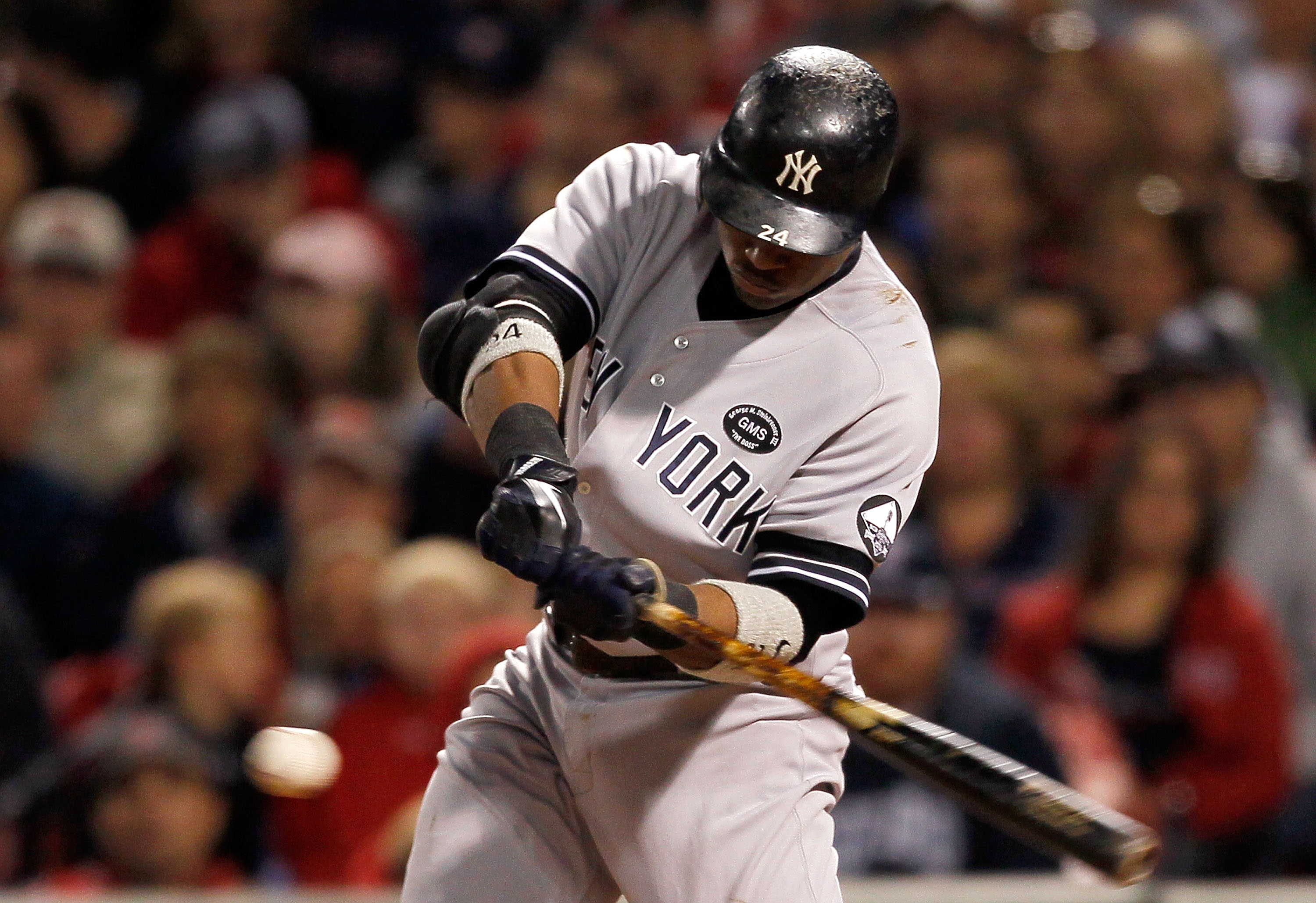 BOSTON - OCTOBER 2:  Robinson Cano #24 of the New York Yankees keeps his eyes on the ball as he connects for a double during the first game of a doubleheader against the Boston Red Sox at Fenway Park October 2, 2010 in Boston, Massachusetts. (Photo by Jim