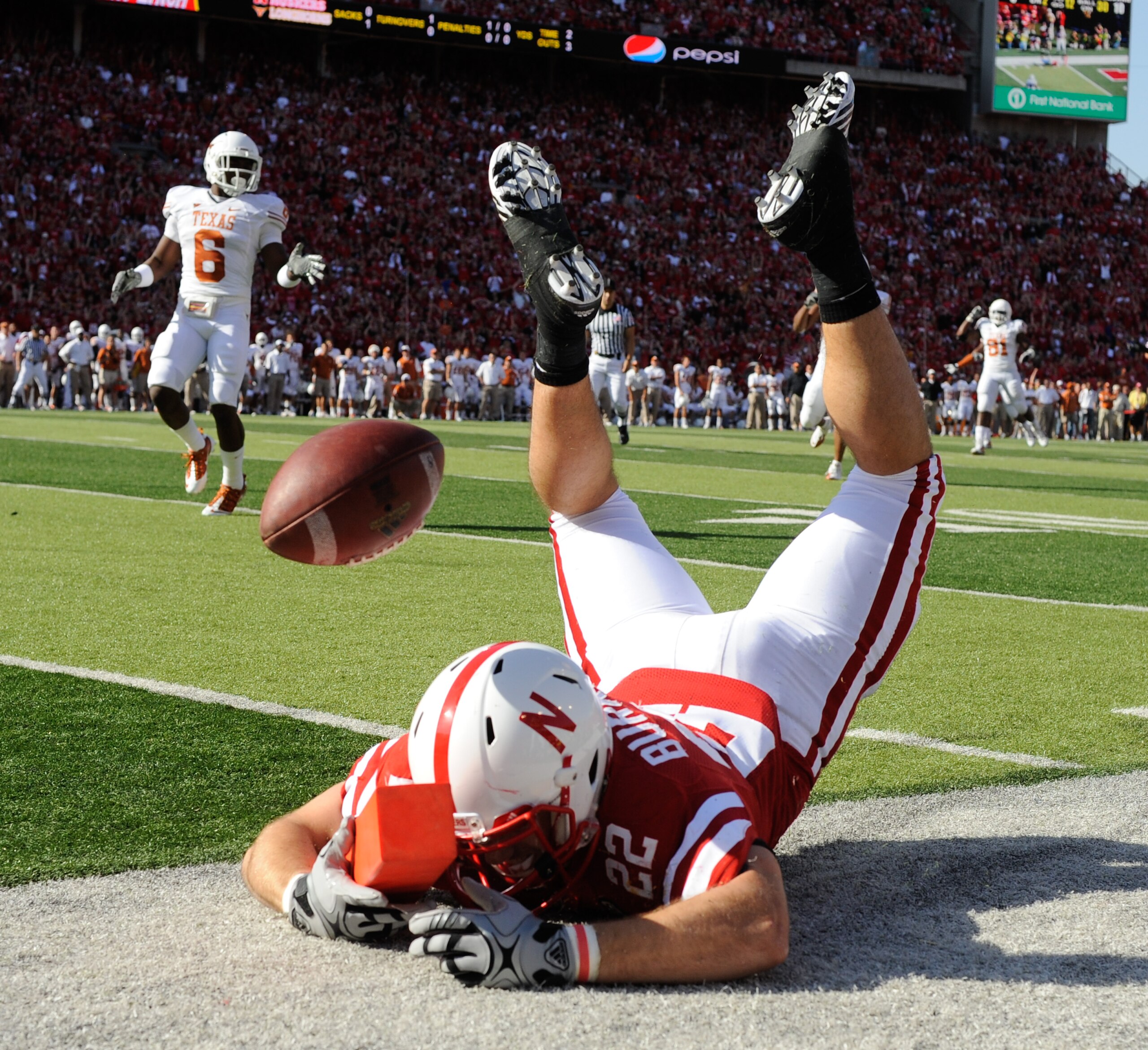 LINCOLN, NE - OCTOBER 16: Running back Rex Burkhead #22 of the Nebraska Cornhuskers just misses a reception during first half action of their game at Memorial Stadium on October 16, 2010 in Lincoln, Nebraska. Texas Defeated Nebraska 20-13. (Photo by Eric 