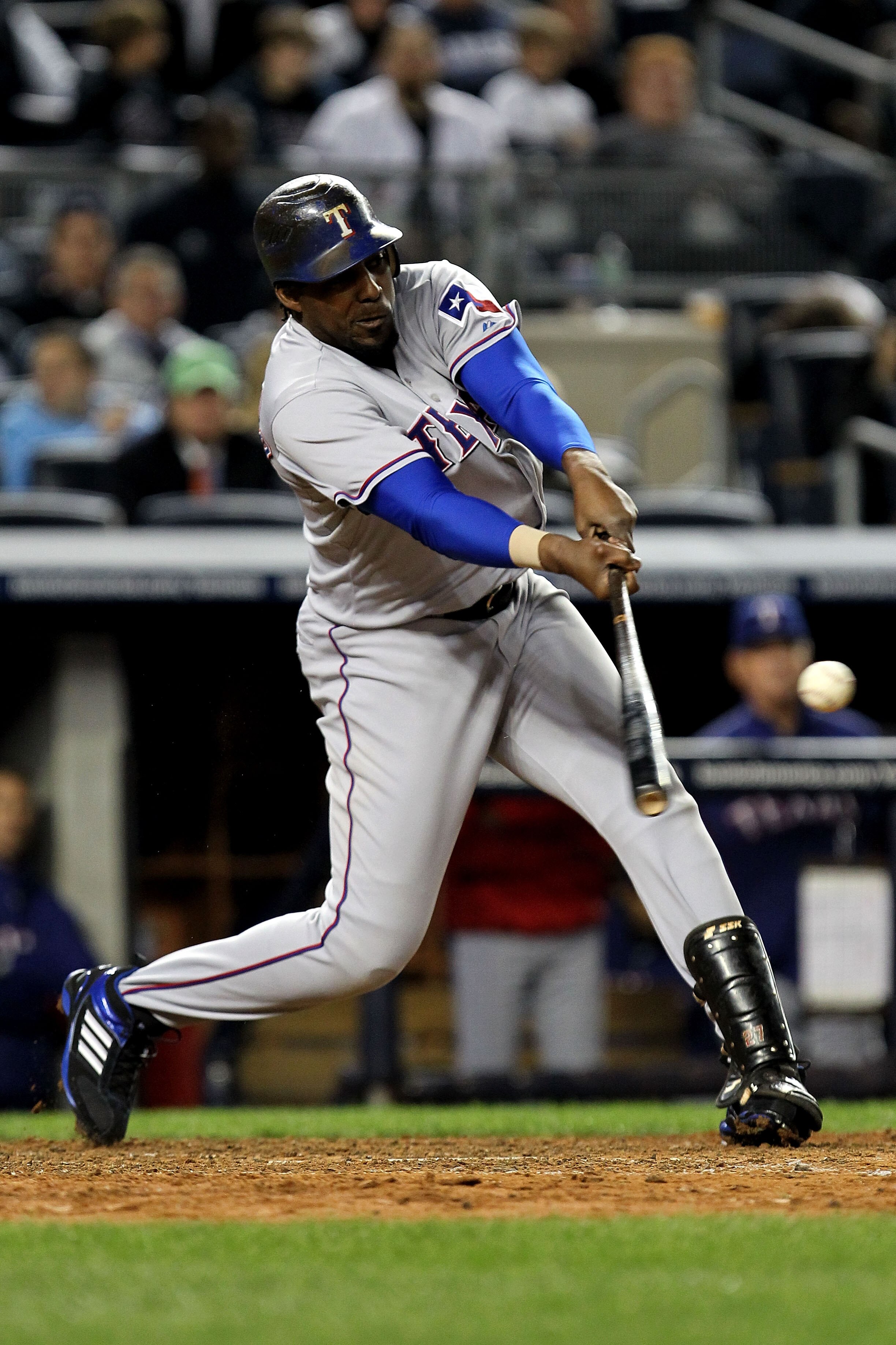 NEW YORK - OCTOBER 18:  Vladimir Guerrero #27 of the Texas Rangers hits a single in the top of the ninth innin against the New York Yankees  in Game Three of the ALCS during the 2010 MLB Playoffs at Yankee Stadium on October 18, 2010 in New York, New York