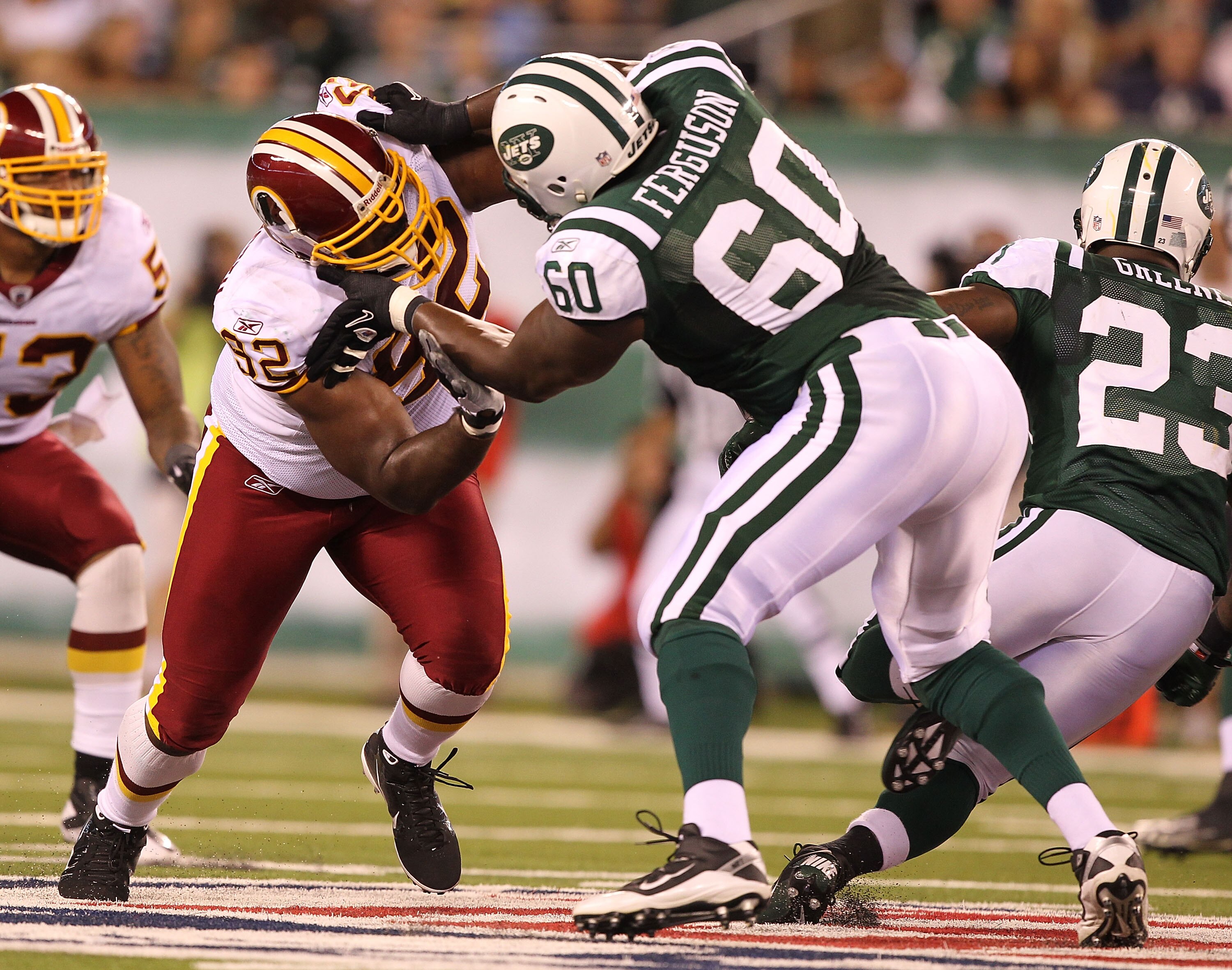 EAST RUTHERFORD, NJ - AUGUST 27:  Albert Haynesworth #92 of the Washington Redskins battles D'Brickashaw Ferguson #60 of the New York Jets during their preseason game on August 27, 2010 at the New Meadowlands Stadium  in East Rutherford, New Jersey.  (Pho