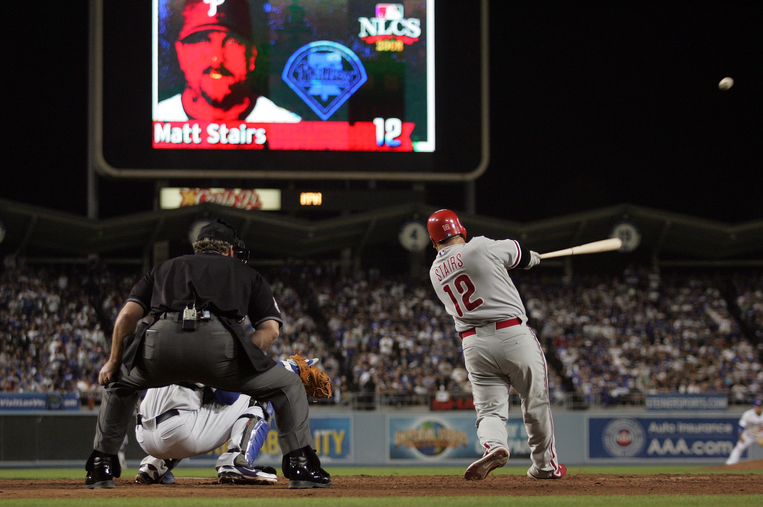 LOS ANGELES, CA - OCTOBER 13:  Matt Stairs #12 of the Philadelphia Phillies hits a two-run pinch hit home run in the eighth inning off Jonathan Broxton #51 of the Los Angeles Dodgers to take a two-run lead in game Game Four of the National League Champion