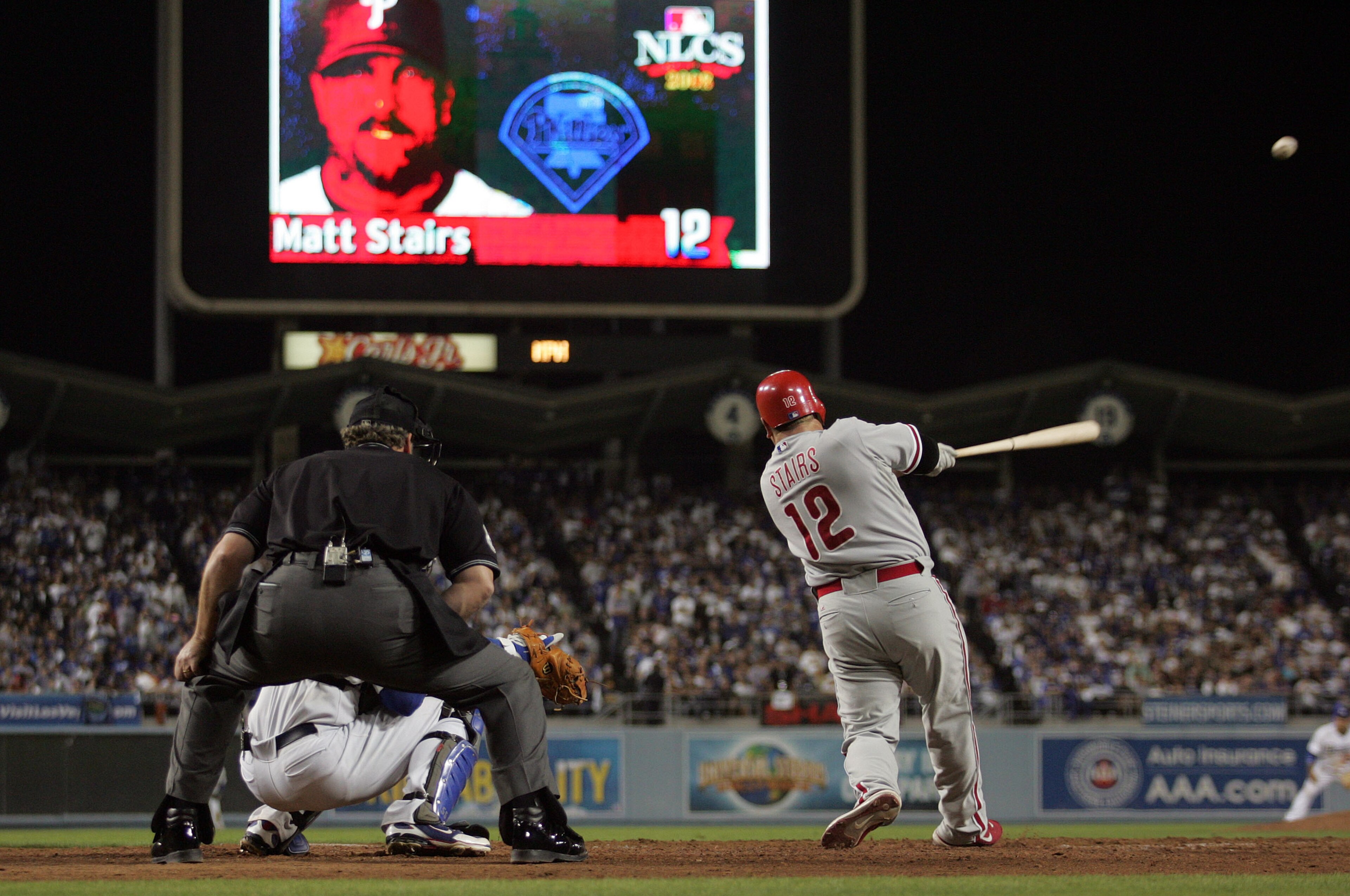 LOS ANGELES, CA - OCTOBER 13:  Matt Stairs #12 of the Philadelphia Phillies hits a two-run pinch hit home run in the eighth inning off Jonathan Broxton #51 of the Los Angeles Dodgers to take a two-run lead in game Game Four of the National League Champion