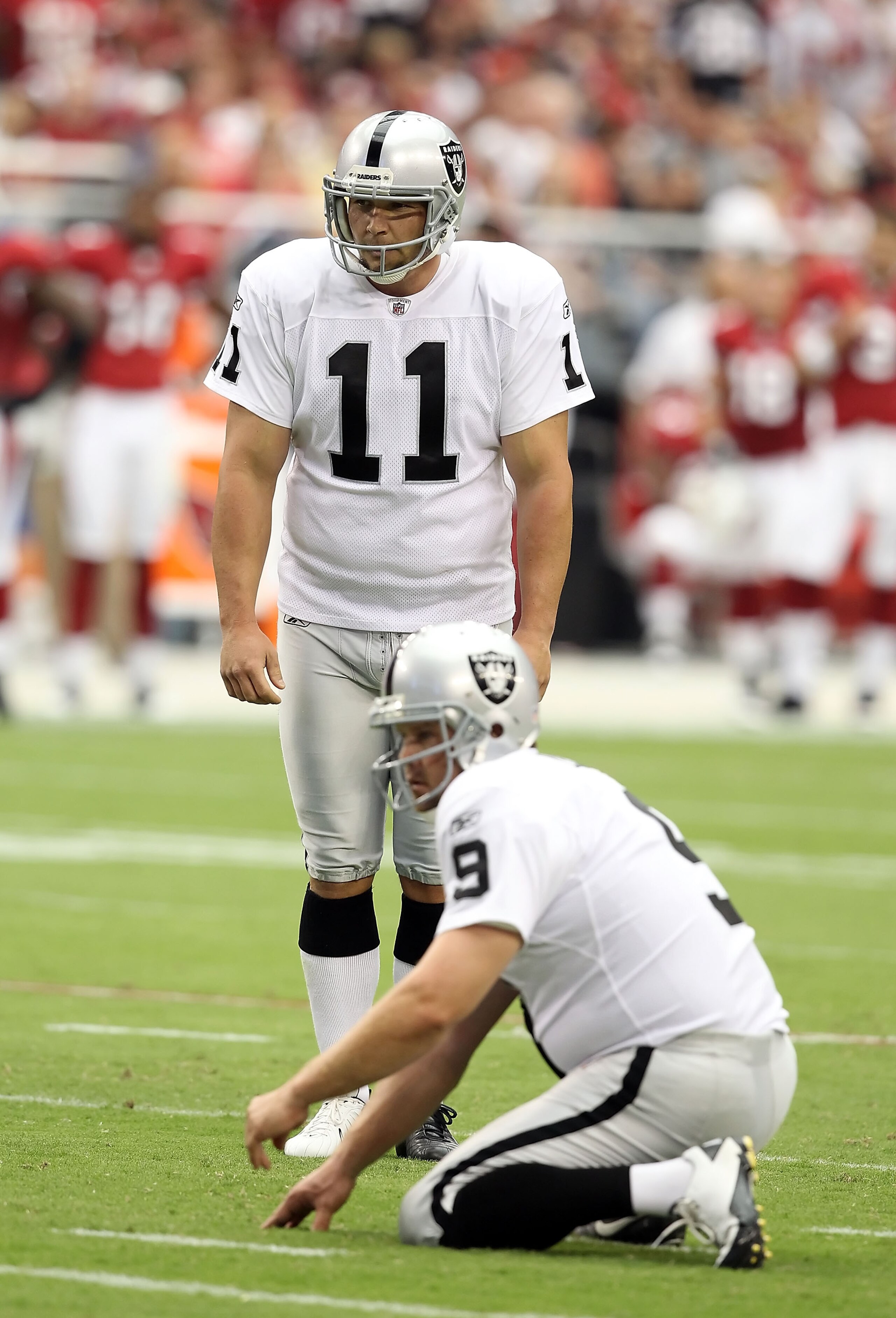 GLENDALE, AZ - SEPTEMBER 26:  Kicker Sebastian Janikowski #11 of the Oakland Raiders attempts a field goal against the Arizona Cardinals during the NFL game at the University of Phoenix Stadium on September 26, 2010 in Glendale, Arizona. The Cardinals def