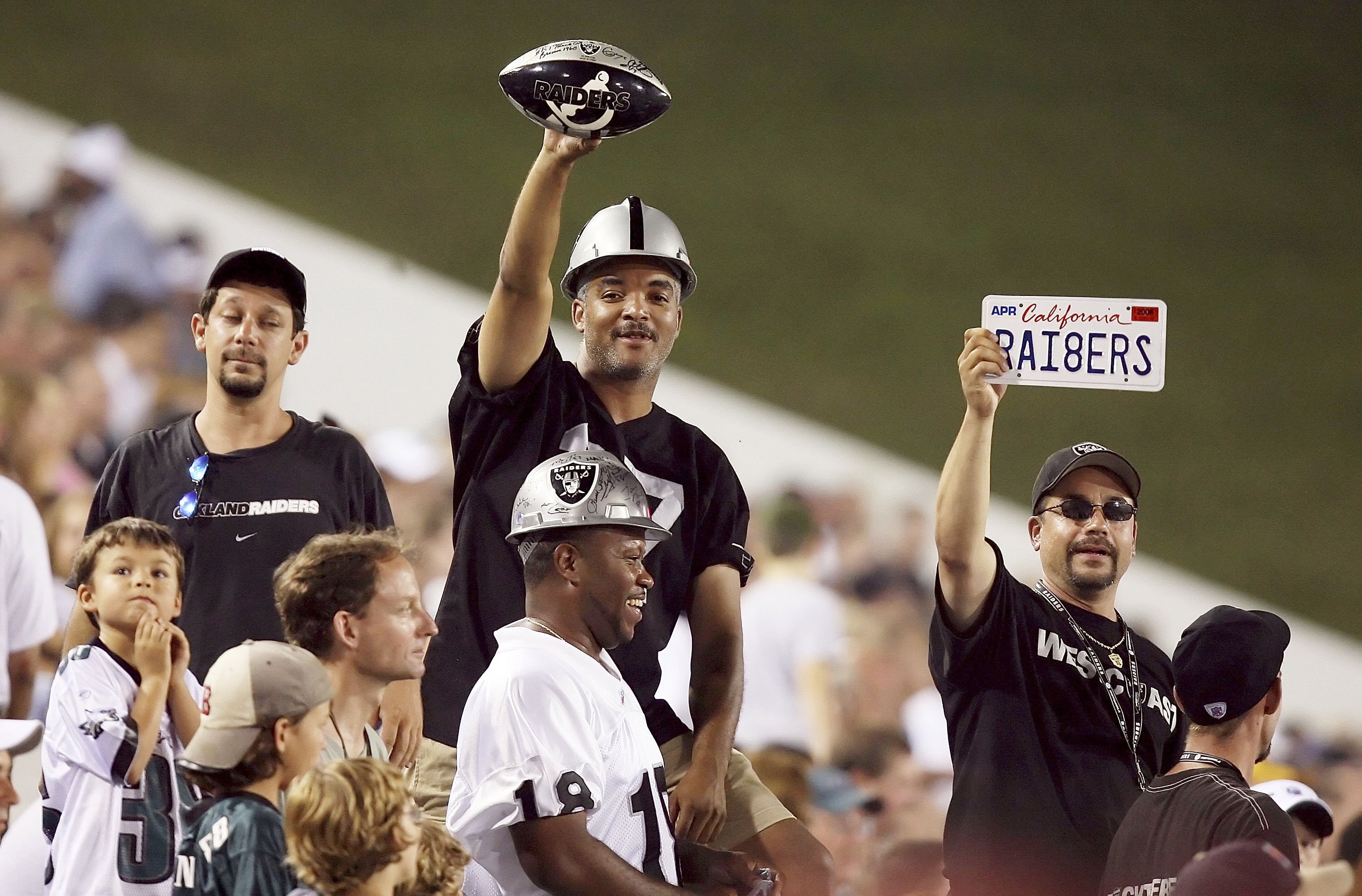 CANTON, OH - AUGUST 6:  Raider fans celebrate as the Oakland Raiders take on the Philadelphia Eagles in the AFC-NFC Pro Football Hall of Fame Game at Fawcett Stadium on August 6, 2006 in Canton, Ohio. The Raiders defeated the Eagles 16-10. (Photo by Doug