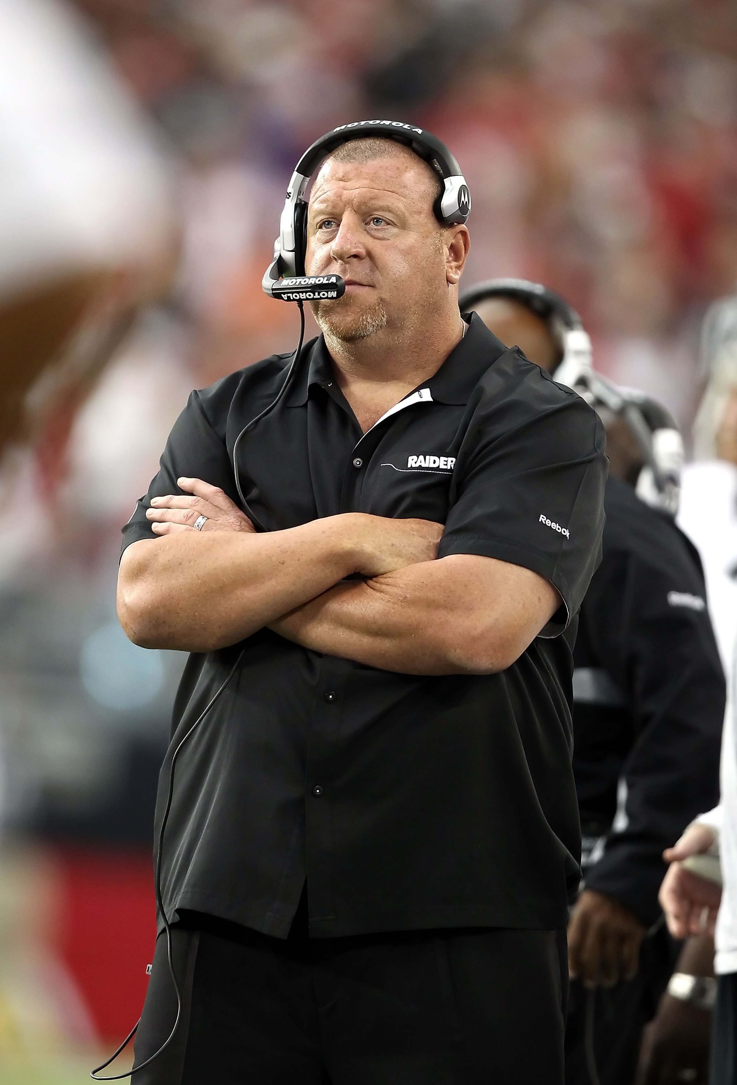 GLENDALE, AZ - SEPTEMBER 26:  Head coach Tom Cable of the Oakland Raiders stands on the sidelines during the NFL game against the Arizona Cardinals at the University of Phoenix Stadium on September 26, 2010 in Glendale, Arizona.  The Cardinals defeated th