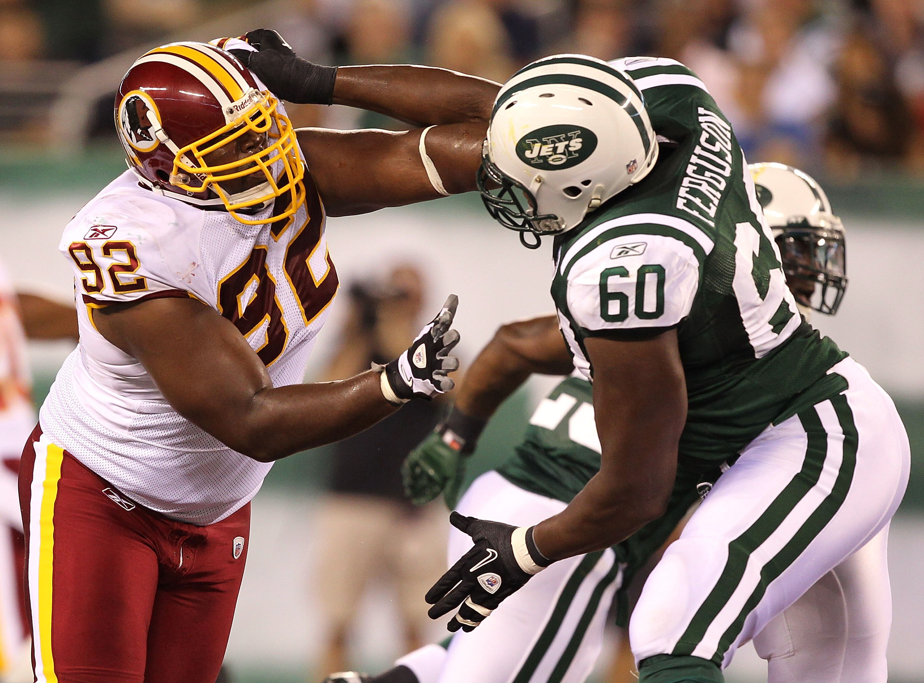 EAST RUTHERFORD, NJ - AUGUST 27:  Albert Haynesworth #92 of the Washington Redskins battles D'Brickashaw Ferguson #60 of the New York Jets during their preseason game on August 27, 2010 at the New Meadowlands Stadium  in East Rutherford, New Jersey.  (Pho