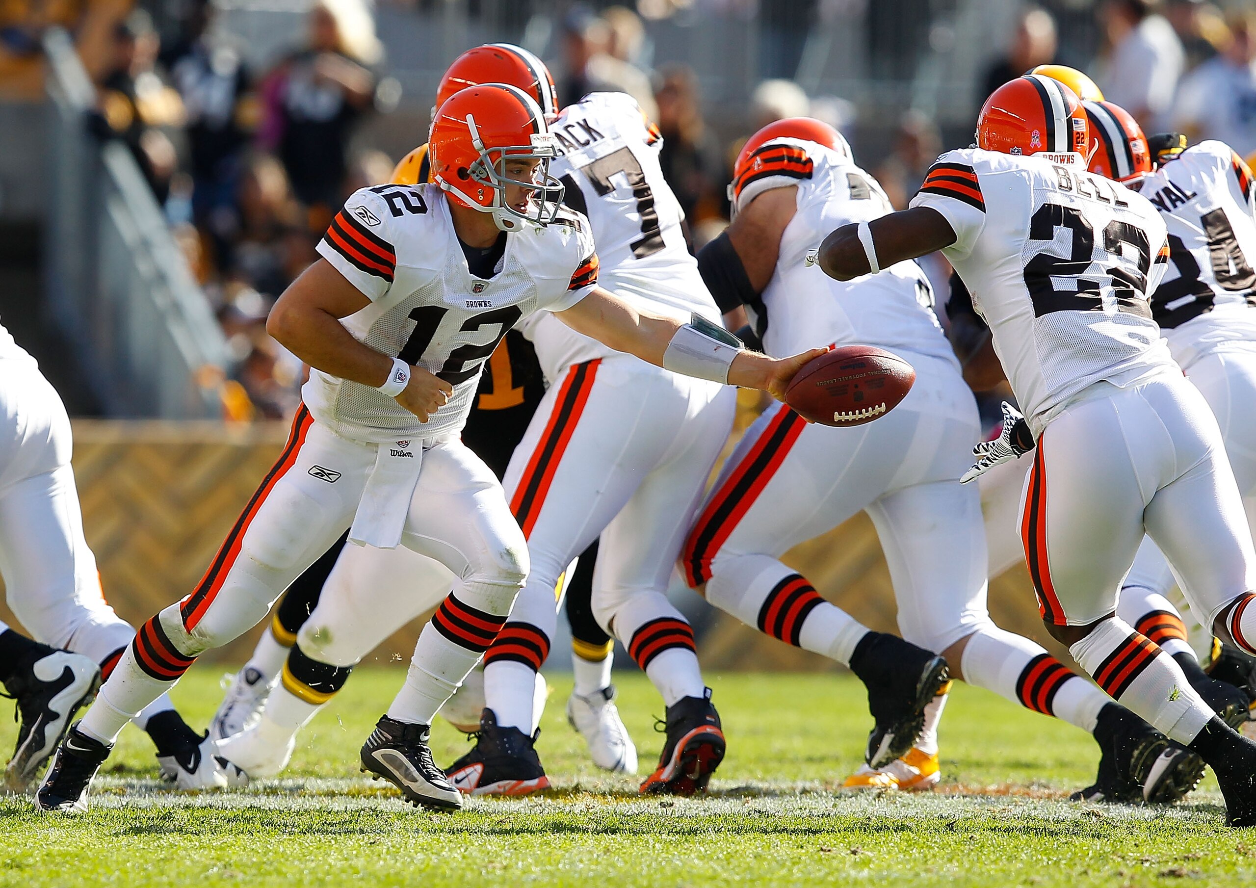 PITTSBURGH - OCTOBER 17: Colt McCoy #12 of the Cleveland Browns hands the ball off to teammate Mike Bell #22 during the game against the Pittsburgh Steelers on October 17, 2010 at Heinz Field in Pittsburgh, Pennsylvania.  (Photo by Jared Wickerham/Getty I