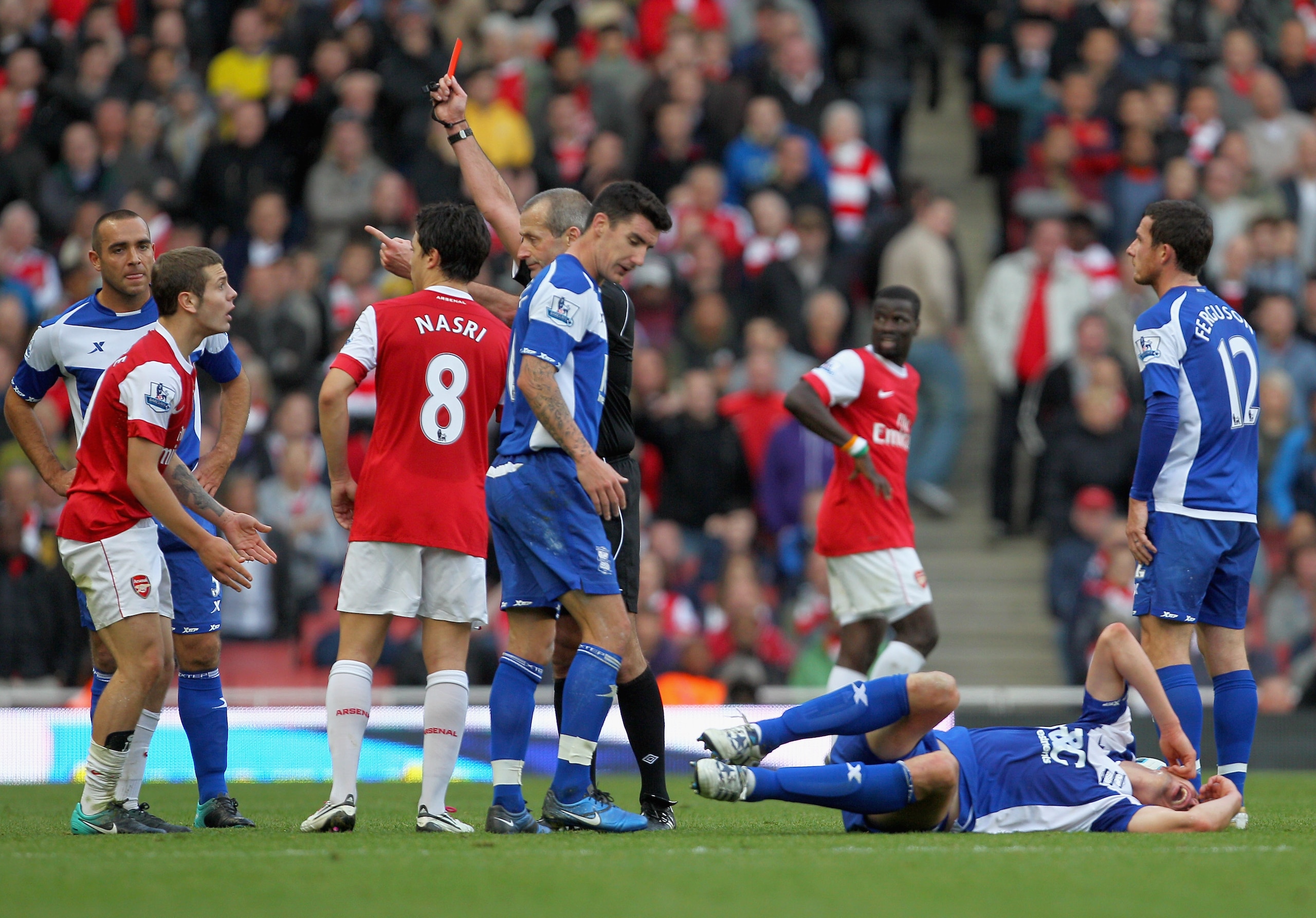 LONDON, ENGLAND - OCTOBER 16:  Jack Wilshere of Arsenal is shown the red card by match referee Martin Atkinson during the Barclays Premier League match between Arsenal and Birmingham City at Emirates Stadium on October 16, 2010 in London, England.  (Photo