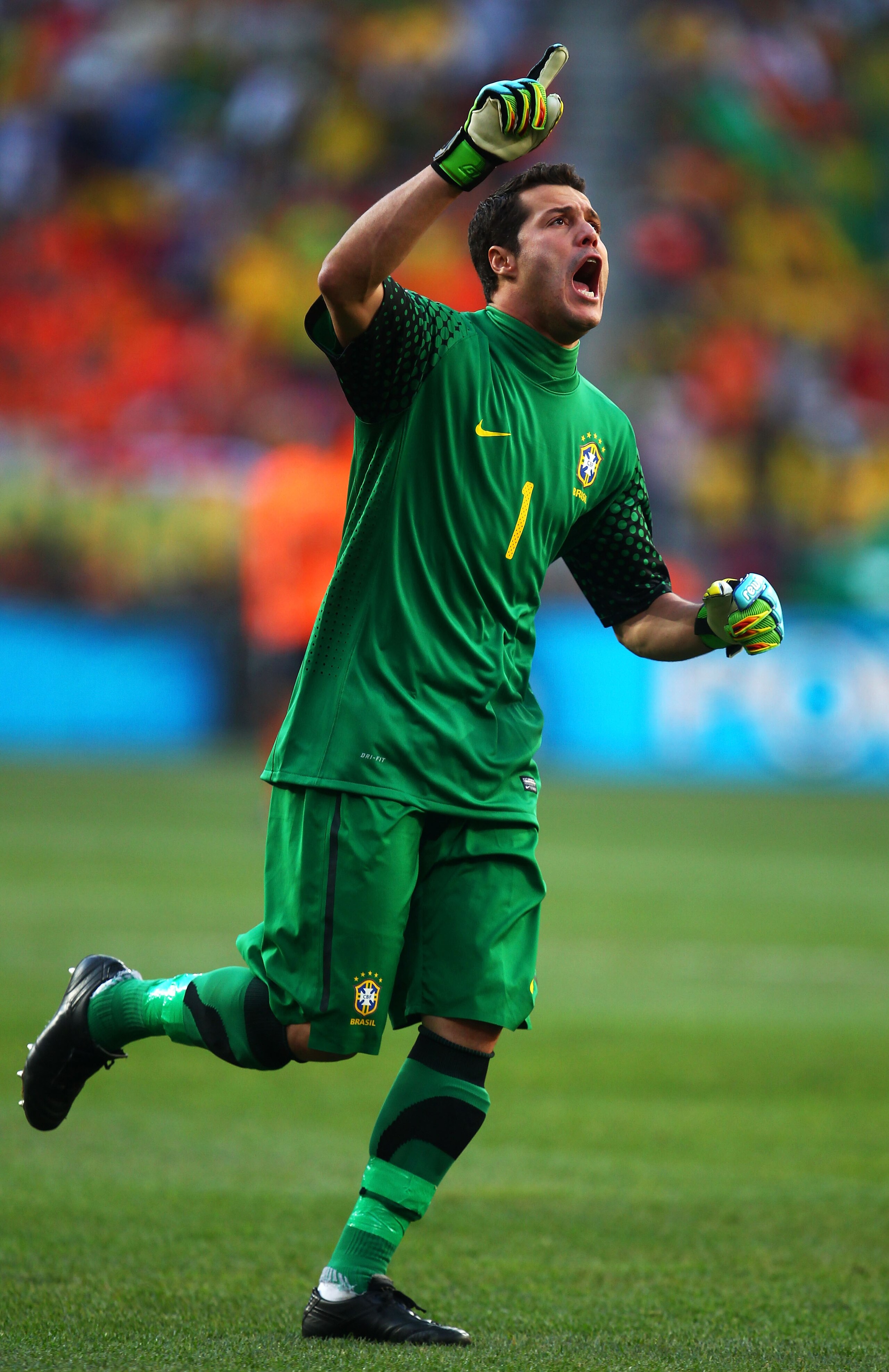 PORT ELIZABETH, SOUTH AFRICA - JULY 02:  Julio Cesar of Brazil celebrates Robinho's opening goal during the 2010 FIFA World Cup South Africa Quarter Final match between Netherlands and Brazil at Nelson Mandela Bay Stadium on July 2, 2010 in Nelson Mandela