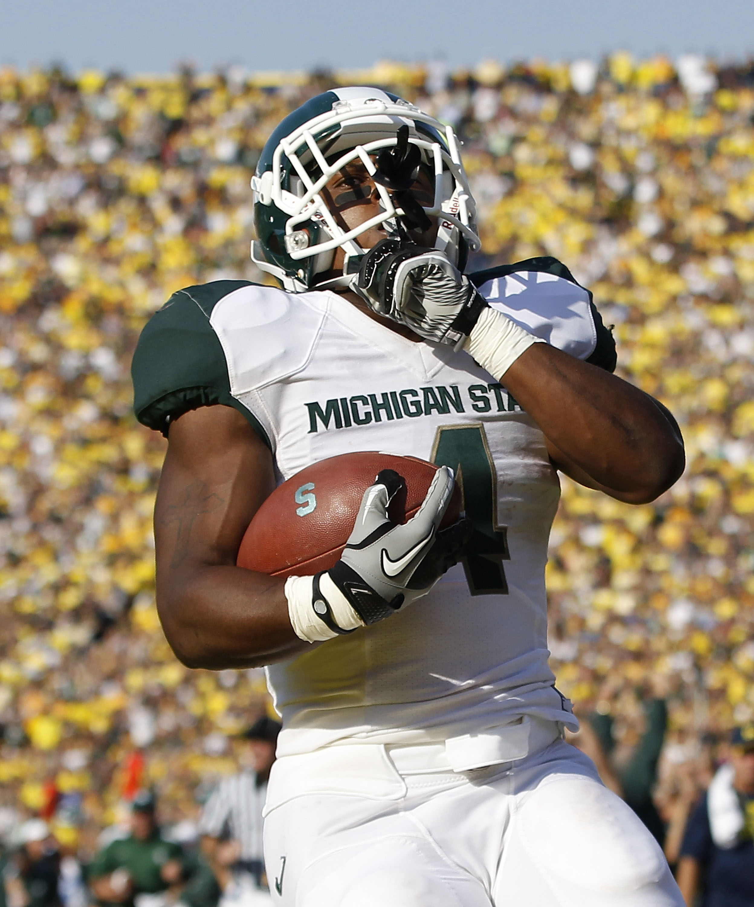 ANN ARBOR, MI - OCTOBER 09: Edwin Baker #4 of the Michigan State Spartans scores on a 61 yard touchdown in the second quarter during the game against the Michigan Wolverines during the game on October 9, 2010 at Michigan Stadium in Ann Arbor, Michigan. Th
