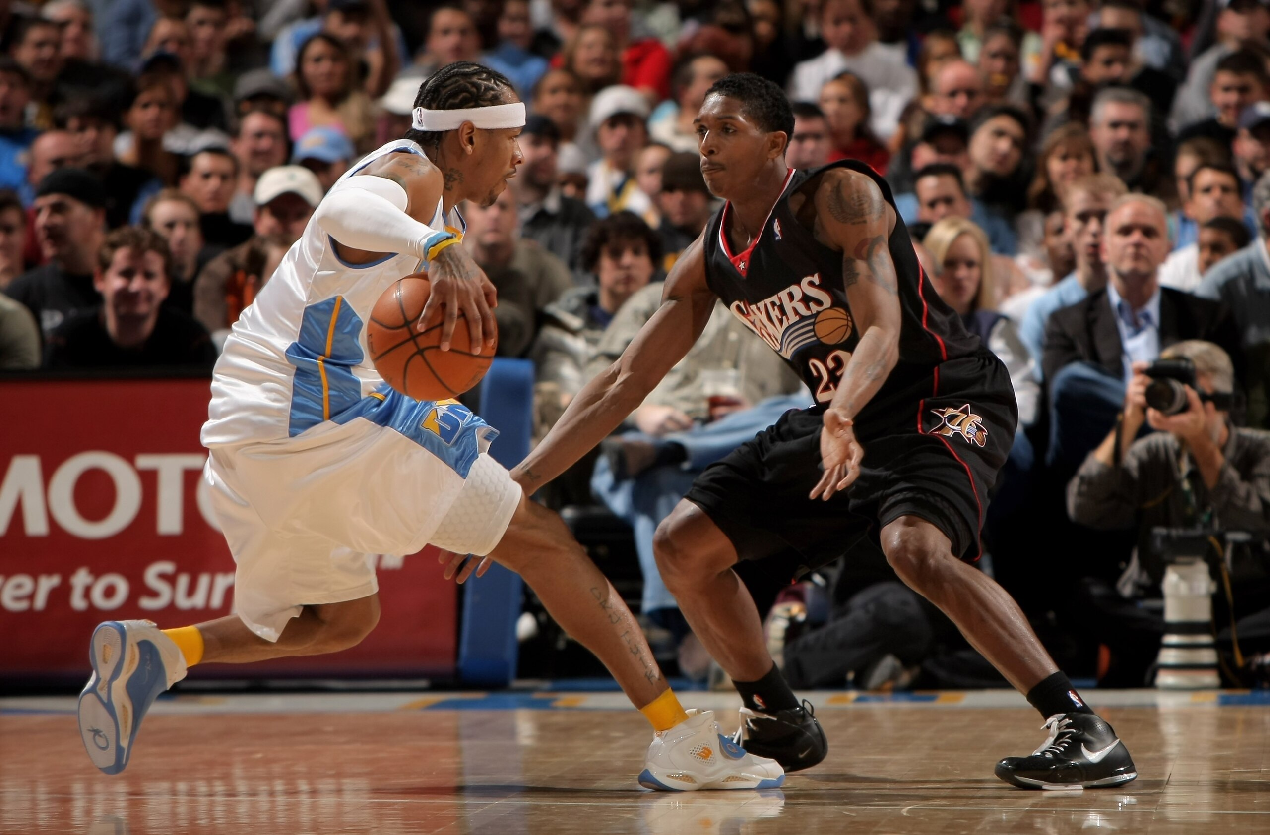 DENVER - JANUARY 06:  Allen Iverson #3 of the Denver Nuggets controls the ball as Louis Williams #23 of the Philadelphia 76ers defends at the Pepsi Center on January 6, 2008 in Denver, Colorado. The Nuggets defeated the Sixers 109-96. NOTE TO USER: User e