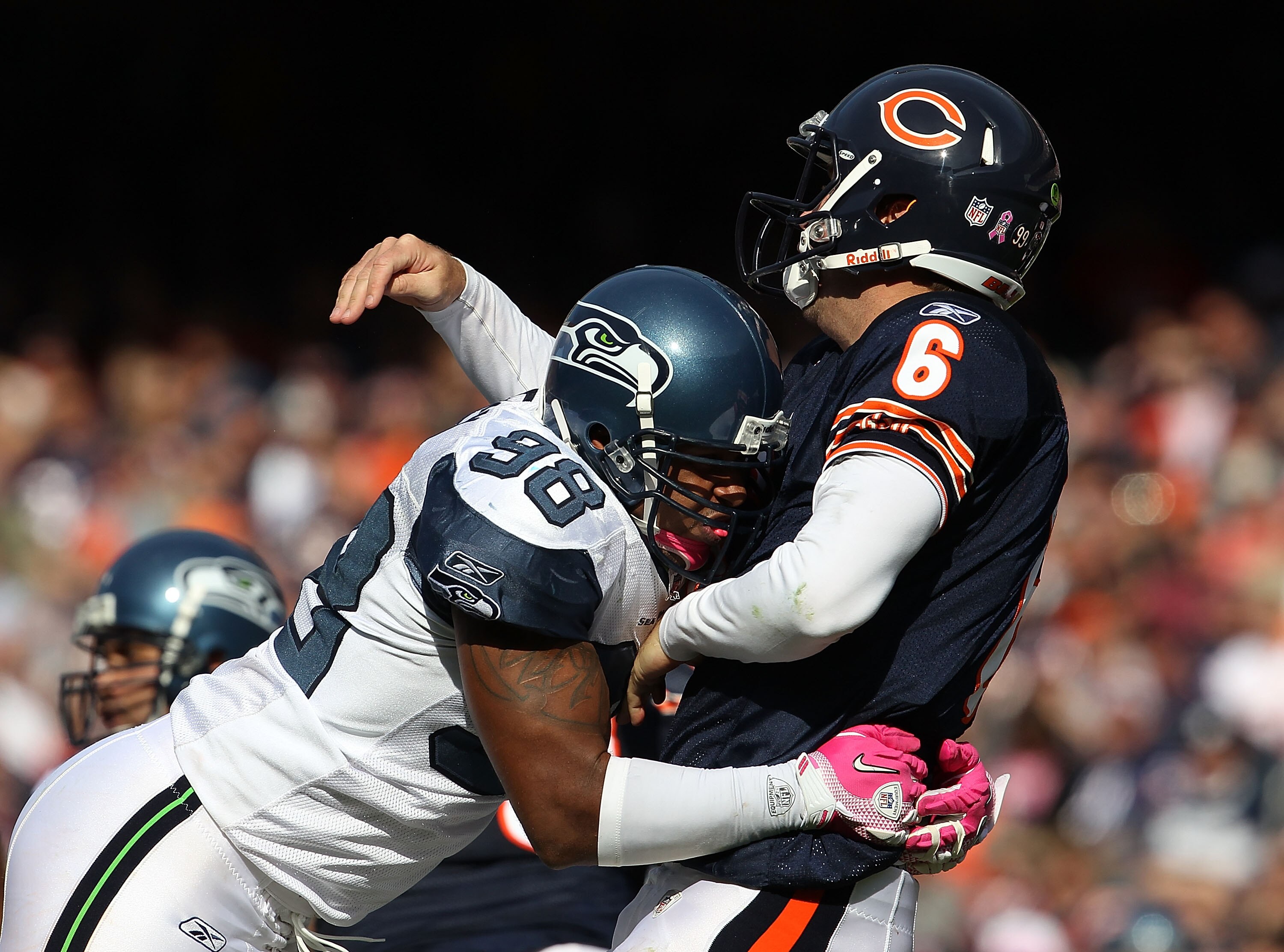 CHICAGO - OCTOBER 17: Jay Cutler #6 of the Chicago Bears is hit after throwing by Raheem Brock #98 of the Seattle Seahawks at Soldier Field on October 17, 2010 in Chicago, Illinois. The Seahawks defeated the Bears 23-20. (Photo by Jonathan Daniel/Getty Im