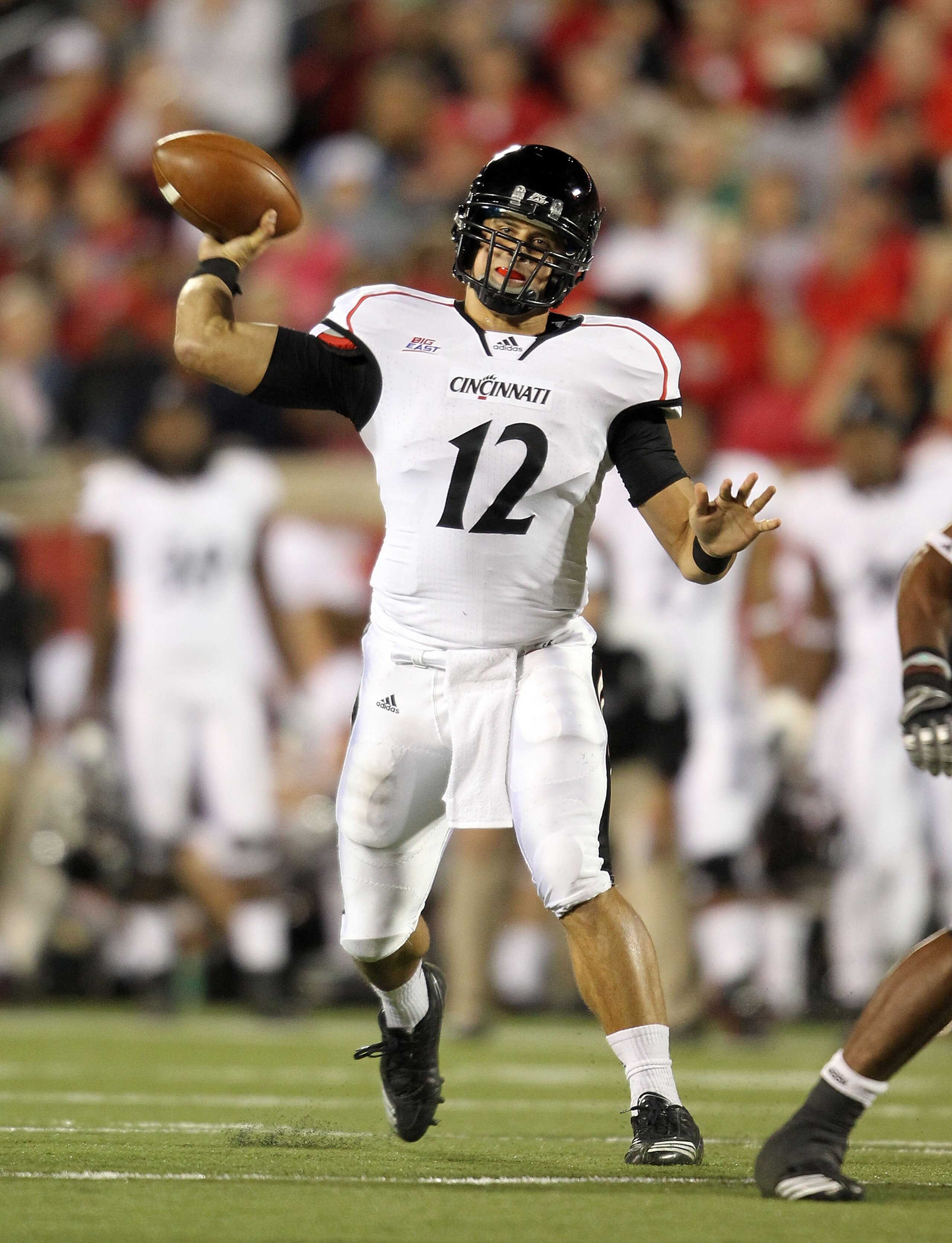 LOUISVILLE, KY - OCTOBER 15:  Zach Collaros #12 of the Cincinnati Bearcats throws a pass during the Big East Conference game against the Louisville Cardinals at Papa John's Cardinal Stadium on October 15, 2010 in Louisville, Kentucky.  (Photo by Andy Lyon