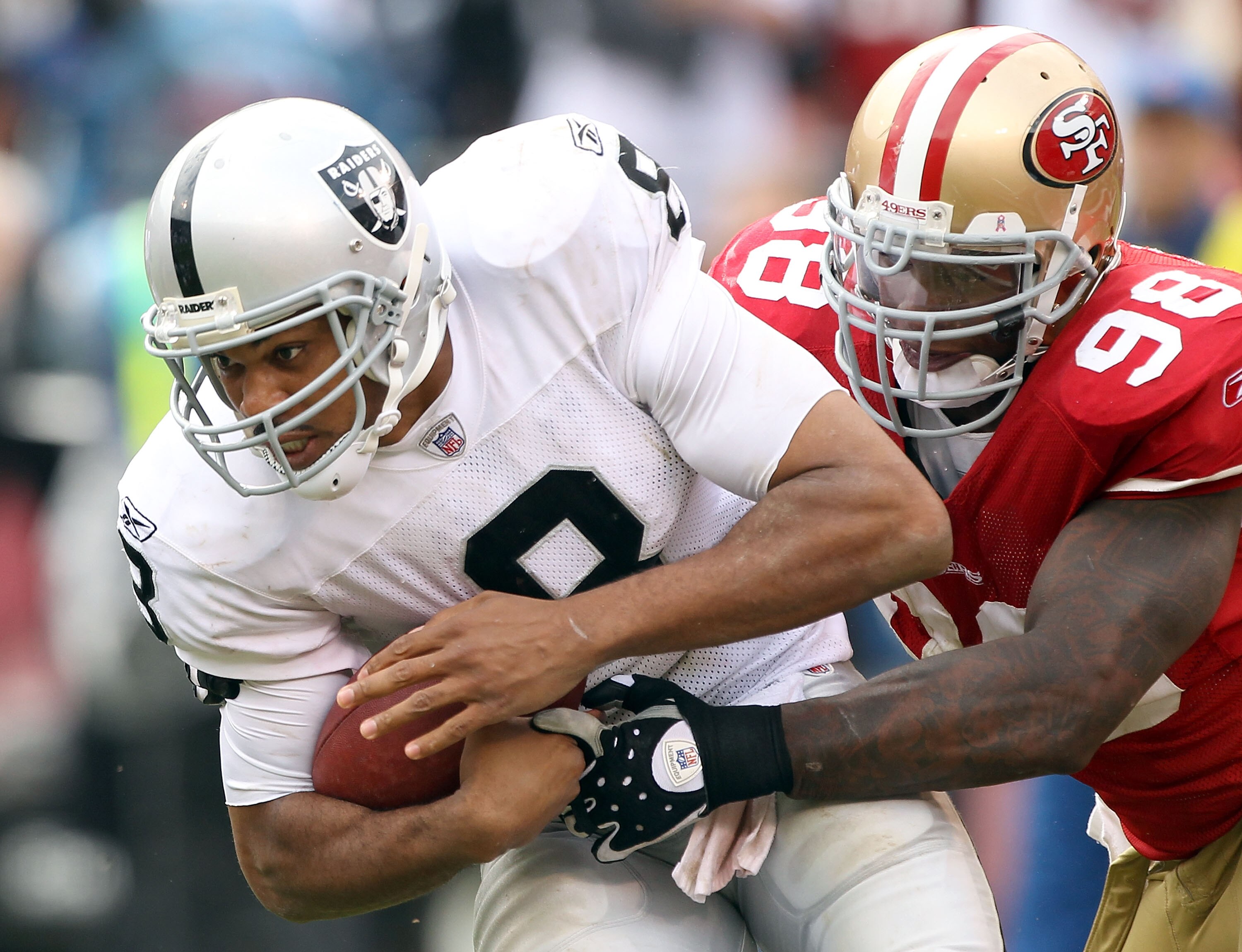 SAN FRANCISCO - OCTOBER 17:  Jason Campbell #8 of the Oakland Raiders is sacked by Parys Haralson #98 of the San Francisco 49ers at Candlestick Park on October 17, 2010 in San Francisco, California.  (Photo by Ezra Shaw/Getty Images)