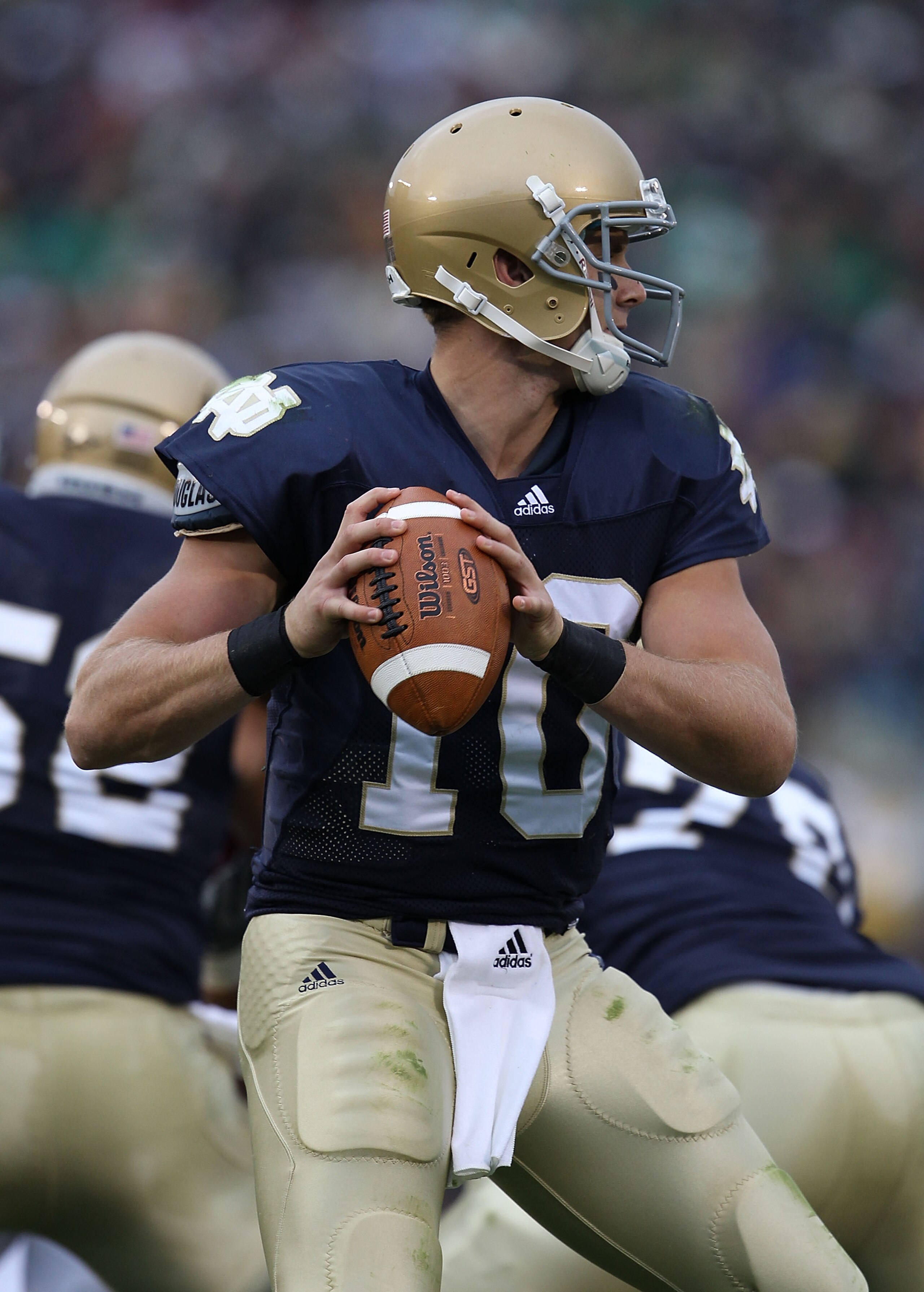 SOUTH BEND, IN - SEPTEMBER 25: Dayne Crist #10 of the Notre Dame Fighting Irish looks for a receiver against the Stanford Cardinal at Notre Dame Stadium on September 25, 2010 in South Bend, Indiana. Stanford defated Notre Dame 37-14.  (Photo by Jonathan D
