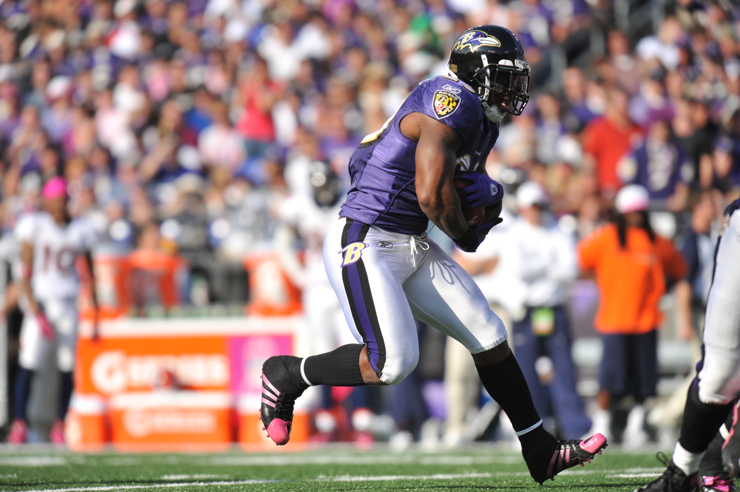 BALTIMORE, MD - OCTOBER 10:  Willis McGahee #23 of the Baltimore Ravens begins his touchdown run against the Denver Broncos at M&T Bank Stadium on October 10, 2010 in Baltimore, Maryland. Players wore pink in recognition of Breast Cancer Awareness Month.