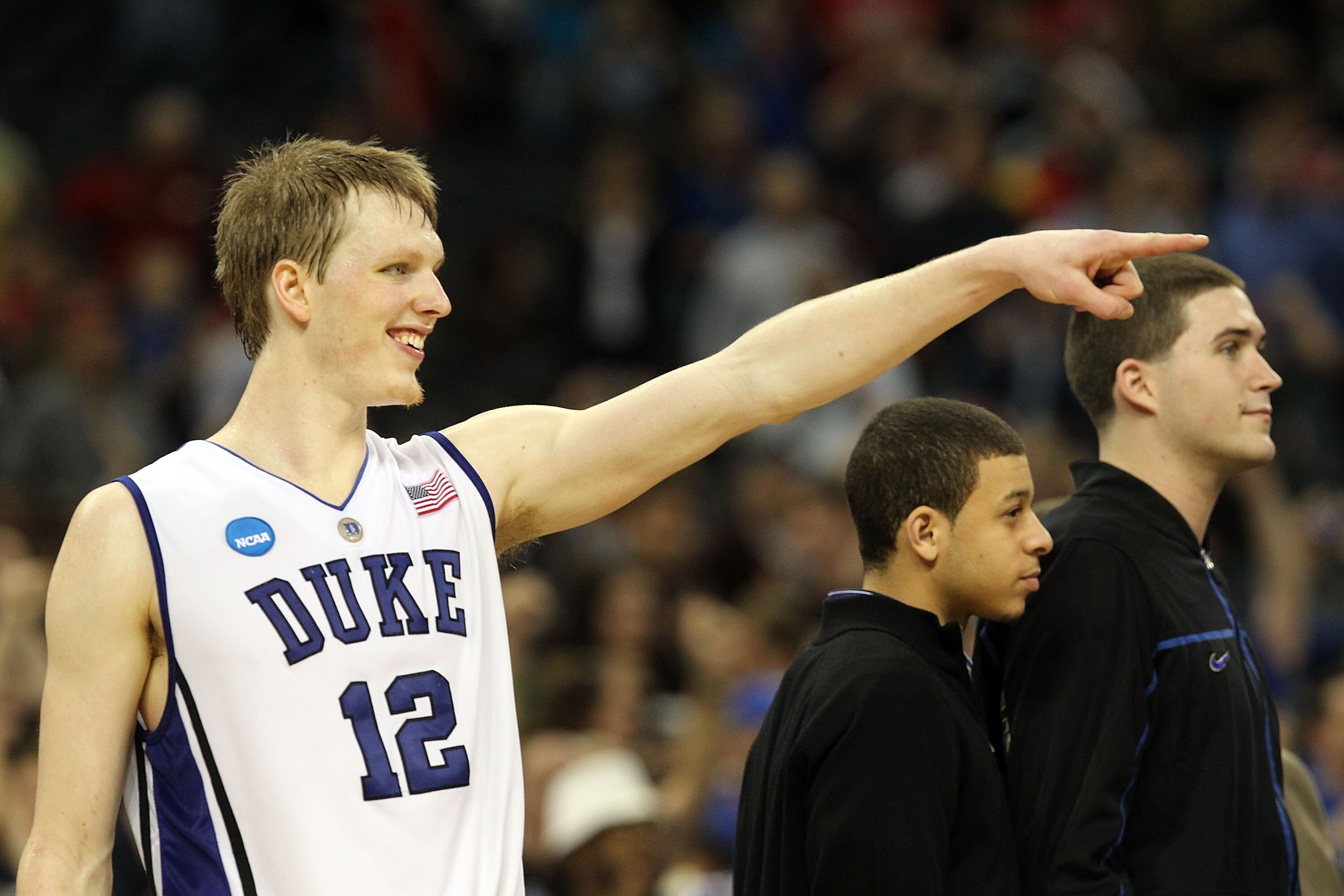 HOUSTON - MARCH 26:  Forward Kyle Singler #12 of the Duke Blue Devils reacts in a 70-57 win against the Purdue Boilermakers during the south regional semifinal of the 2010 NCAA men's basketball tournament at Reliant Stadium on March 26, 2010 in Houston, T