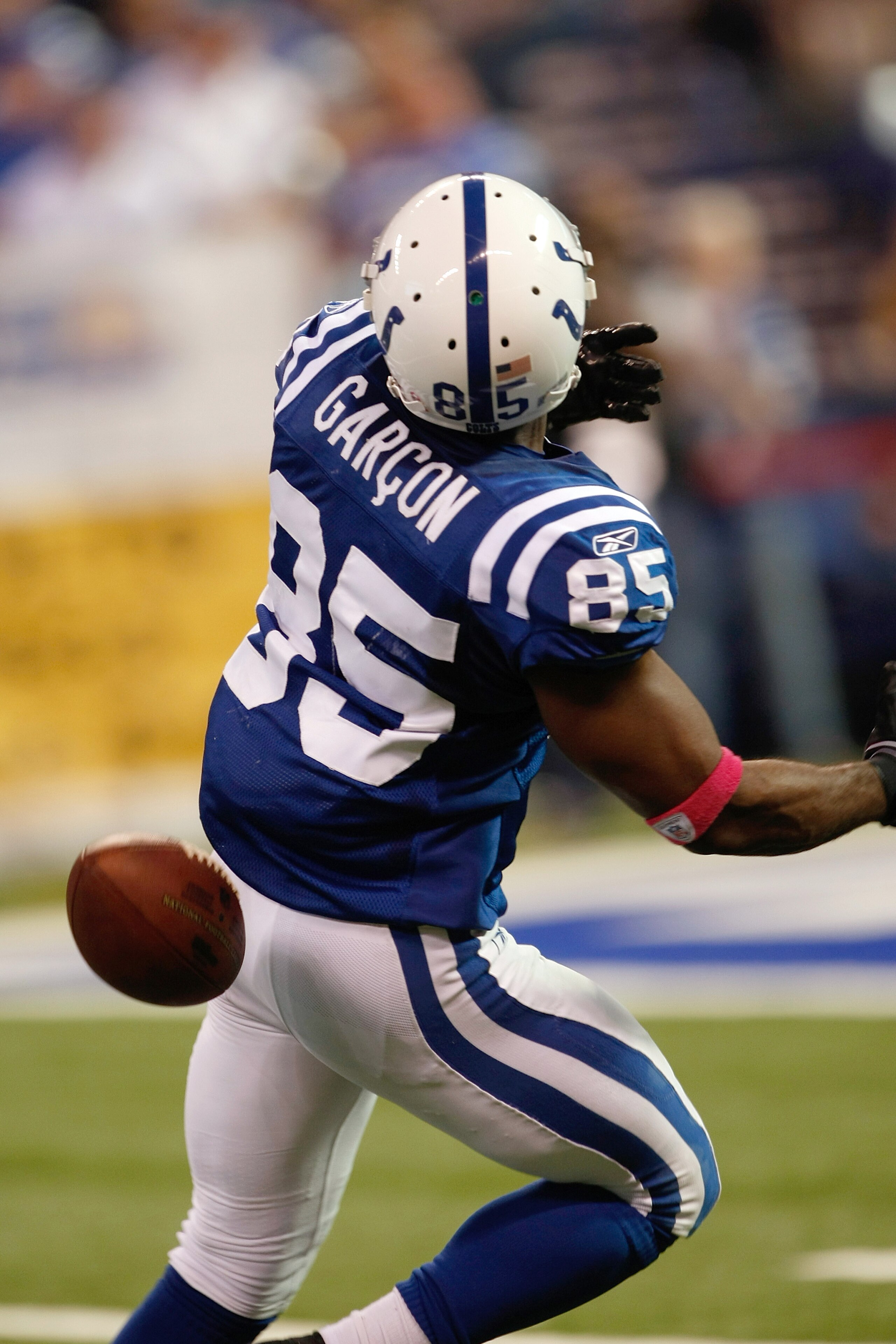 INDIANAPOLIS, IN - OCTOBER 10: Pierre Garcon #85 of the Indianapolis Colts is hit in the back by the football against the Kansas City Chiefs at Lucas Oil Stadium on October 10, 2010 in Indianapolis, Indiana. The Colts defeated the Chiefs 19-9. (Photo by S
