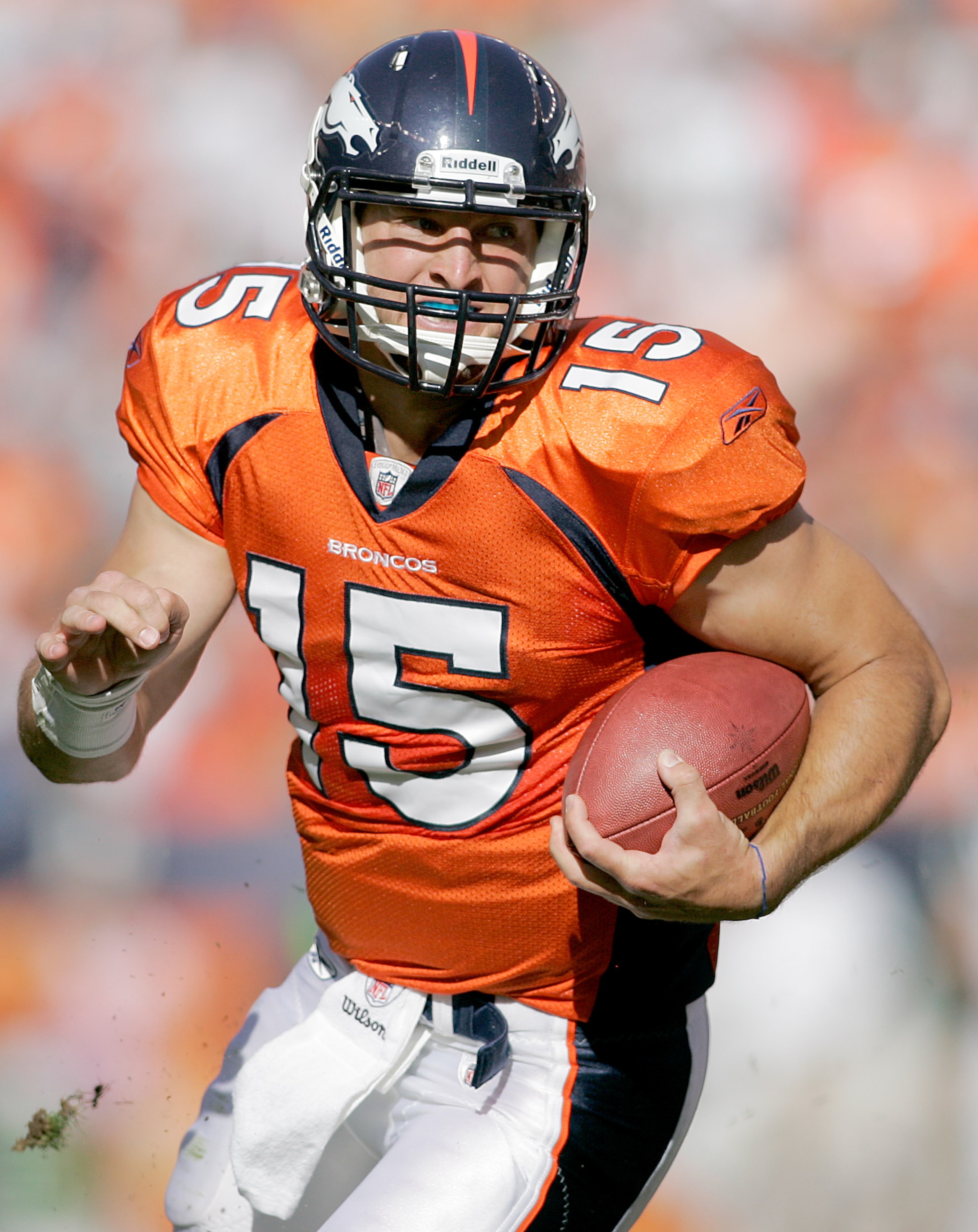 DENVER - OCTOBER 17:  Quarterback Tim Tebow #15 of the Denver Broncos runs for a touchdown against the New York Jets at INVESCO Field at Mile High on October 17, 2010 in Denver, Colorado.  (Photo by Justin Edmonds/Getty Images)