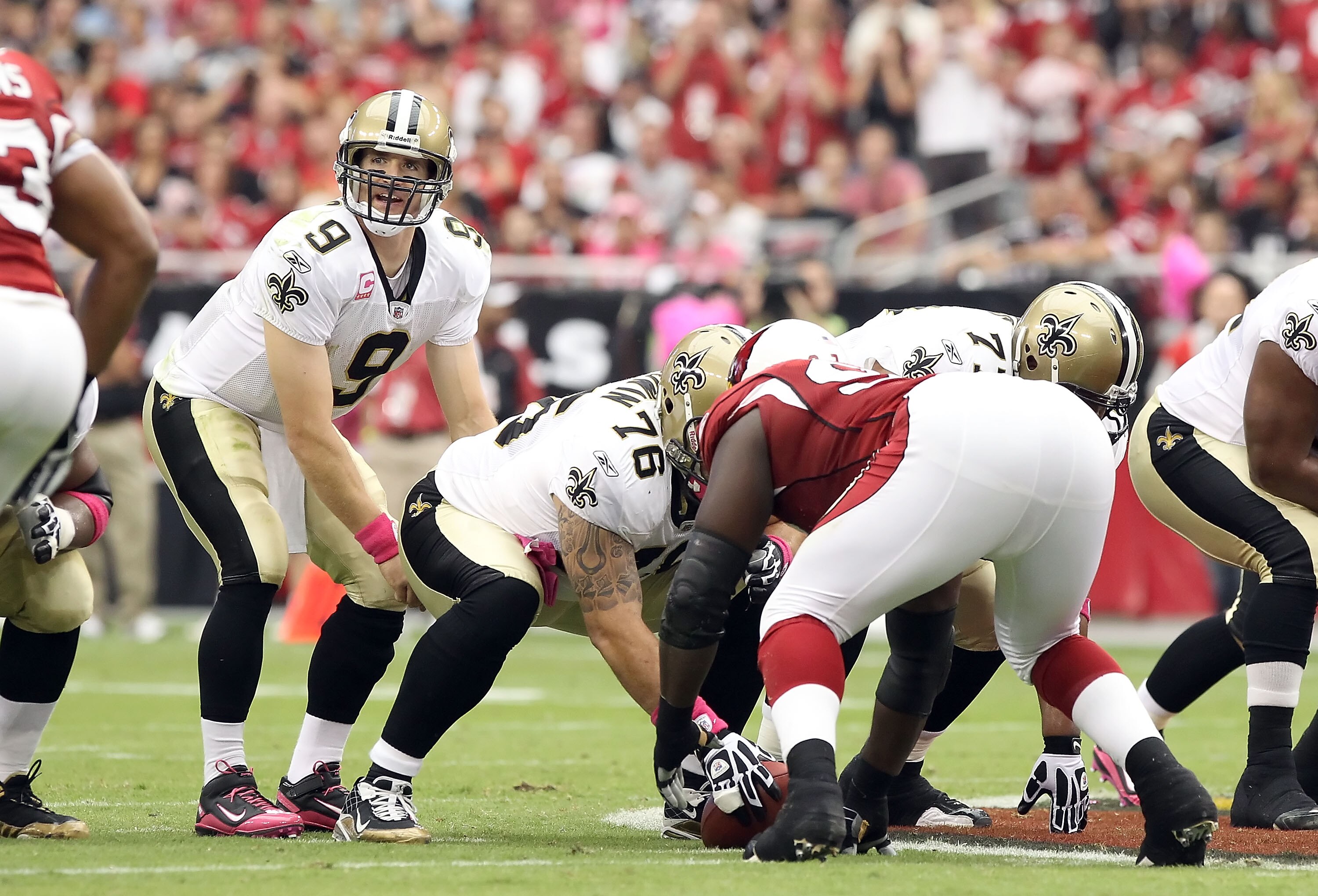 GLENDALE, AZ - OCTOBER 10:  Quarterback Drew Brees #9 of the New Orleans Saints prepares to snap the ball during the NFL game against the Arizona Cardinals at the University of Phoenix Stadium on October 10, 2010 in Glendale, Arizona. The Cardinals defeat