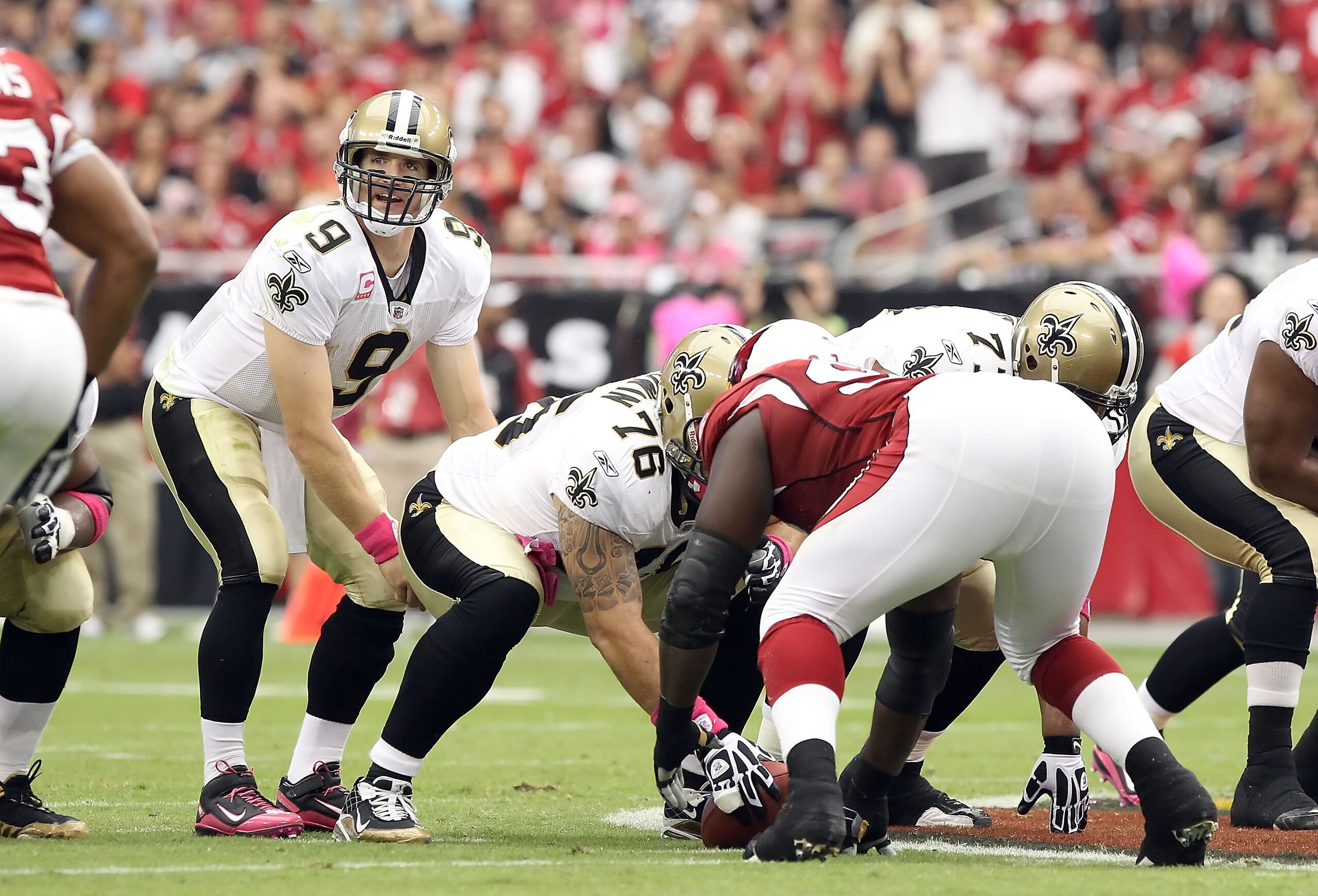 GLENDALE, AZ - OCTOBER 10:  Quarterback Drew Brees #9 of the New Orleans Saints prepares to snap the ball during the NFL game against the Arizona Cardinals at the University of Phoenix Stadium on October 10, 2010 in Glendale, Arizona. The Cardinals defeat