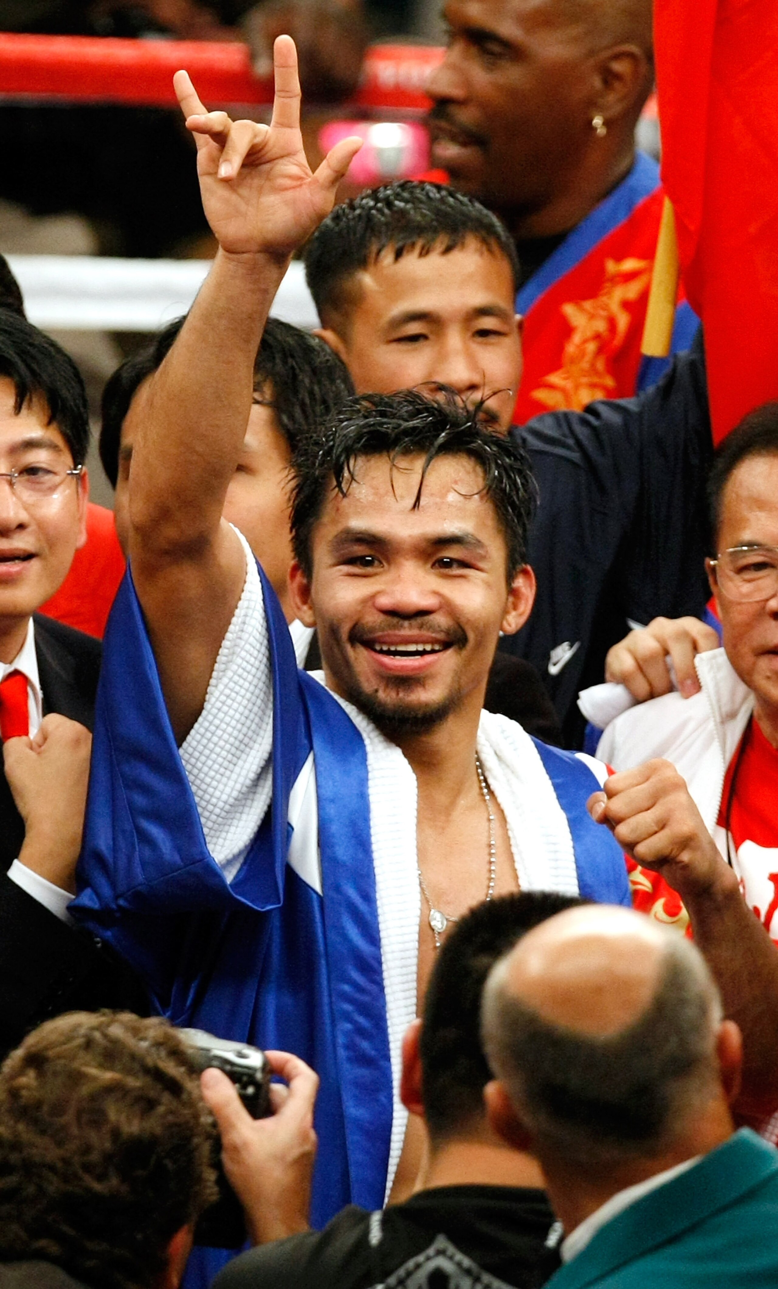 LAS VEGAS - DECEMBER 06:  Manny Pacquiao of the Philippines celebrates his victory over Oscar De La Hoya in their welterweight bout at the MGM Grand Garden Arena December 6, 2008 in Las Vegas, Nevada.  (Photo by Ethan Miller/Getty Images)