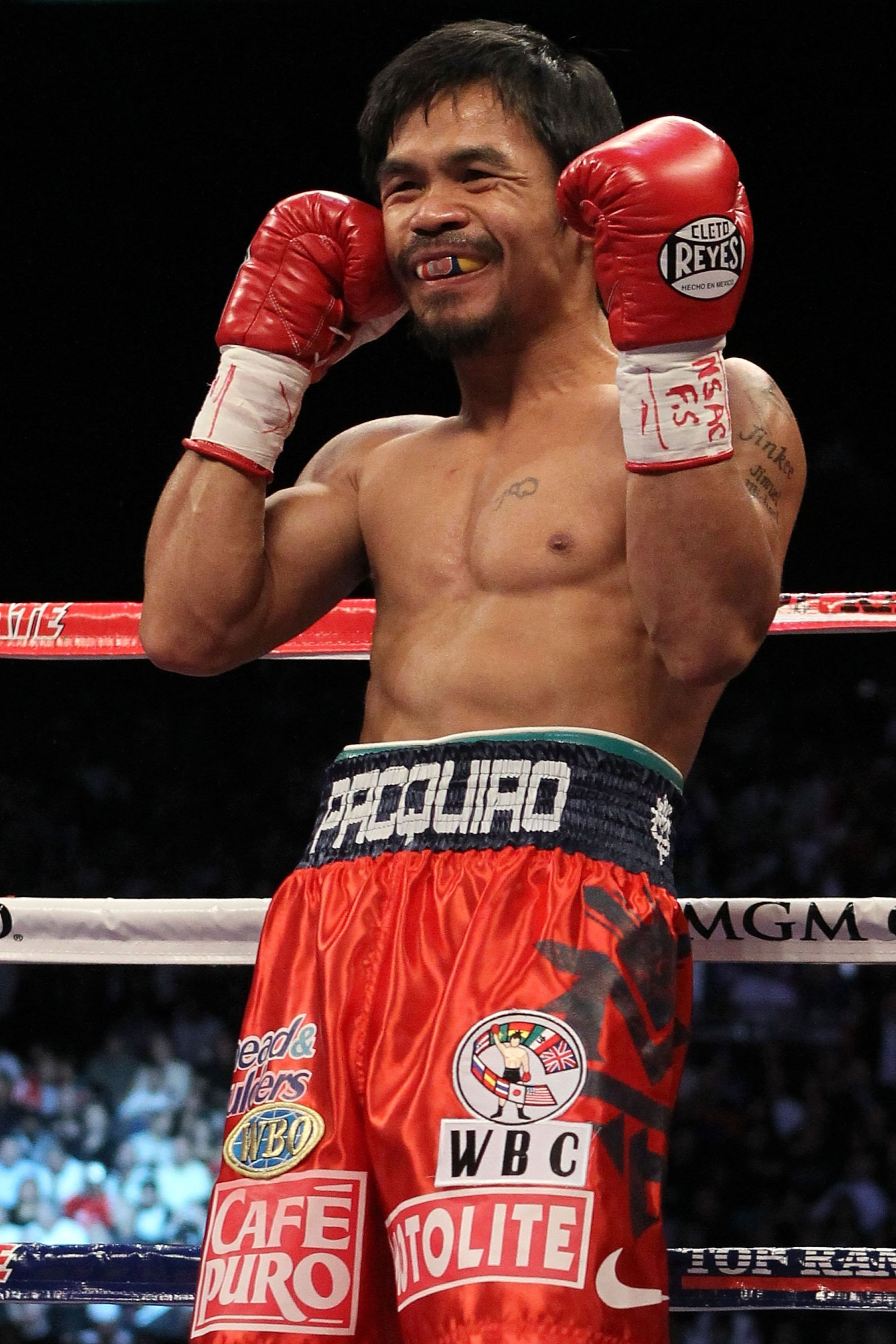 LAS VEGAS - NOVEMBER 14:  Manny Pacquiao smiles before taking on Miguel Cotto during their WBO welterweight title fight at the MGM Grand Garden Arena on November 14, 2009 in Las Vegas, Nevada.  (Photo by Al Bello/Getty Images)