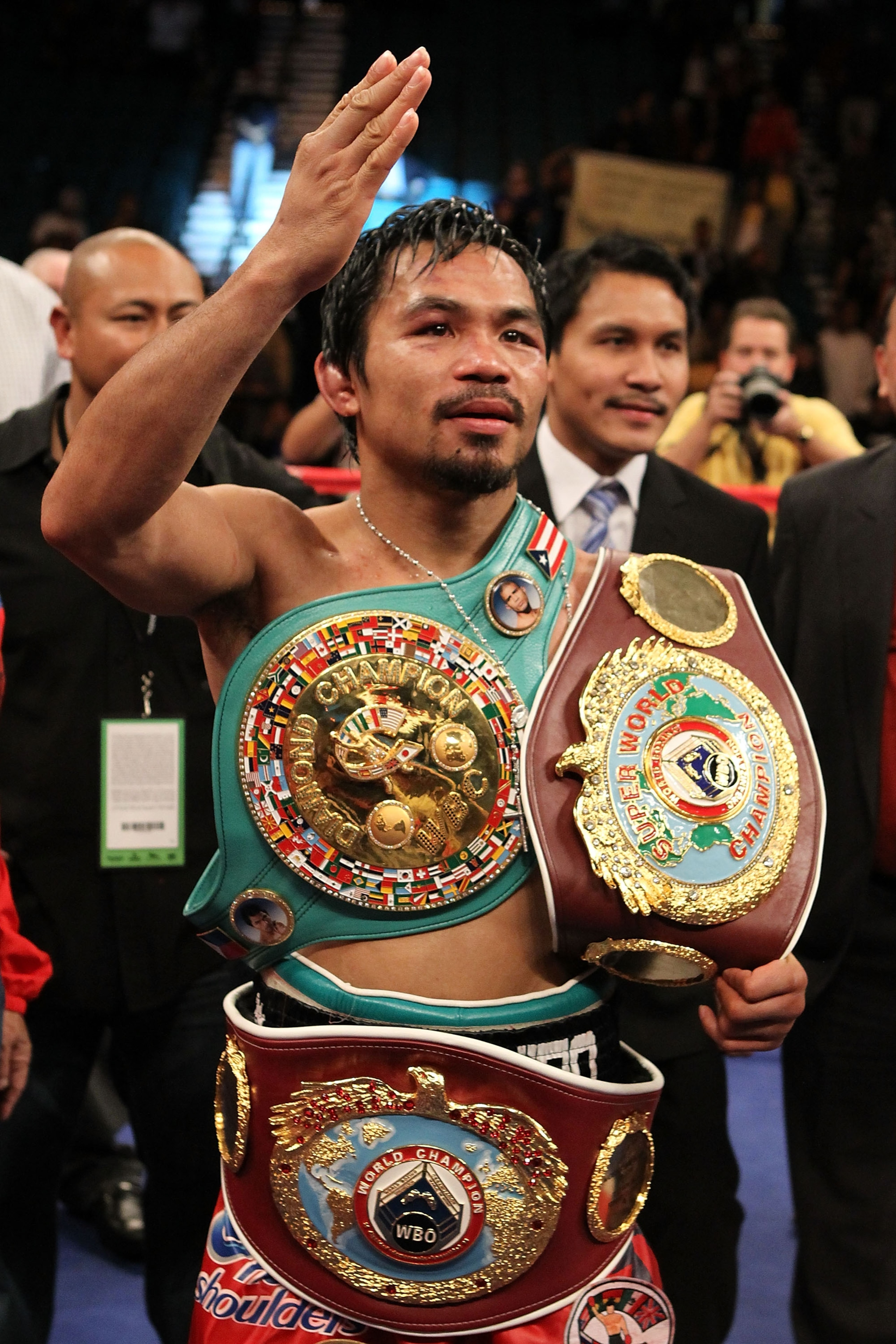 LAS VEGAS - NOVEMBER 14:  Manny Pacquiao celebrates his 12 round TKO victory against Miguel Cotto during their WBO welterweight title fight at the MGM Grand Garden Arena on November 14, 2009 in Las Vegas, Nevada.  (Photo by Al Bello/Getty Images)