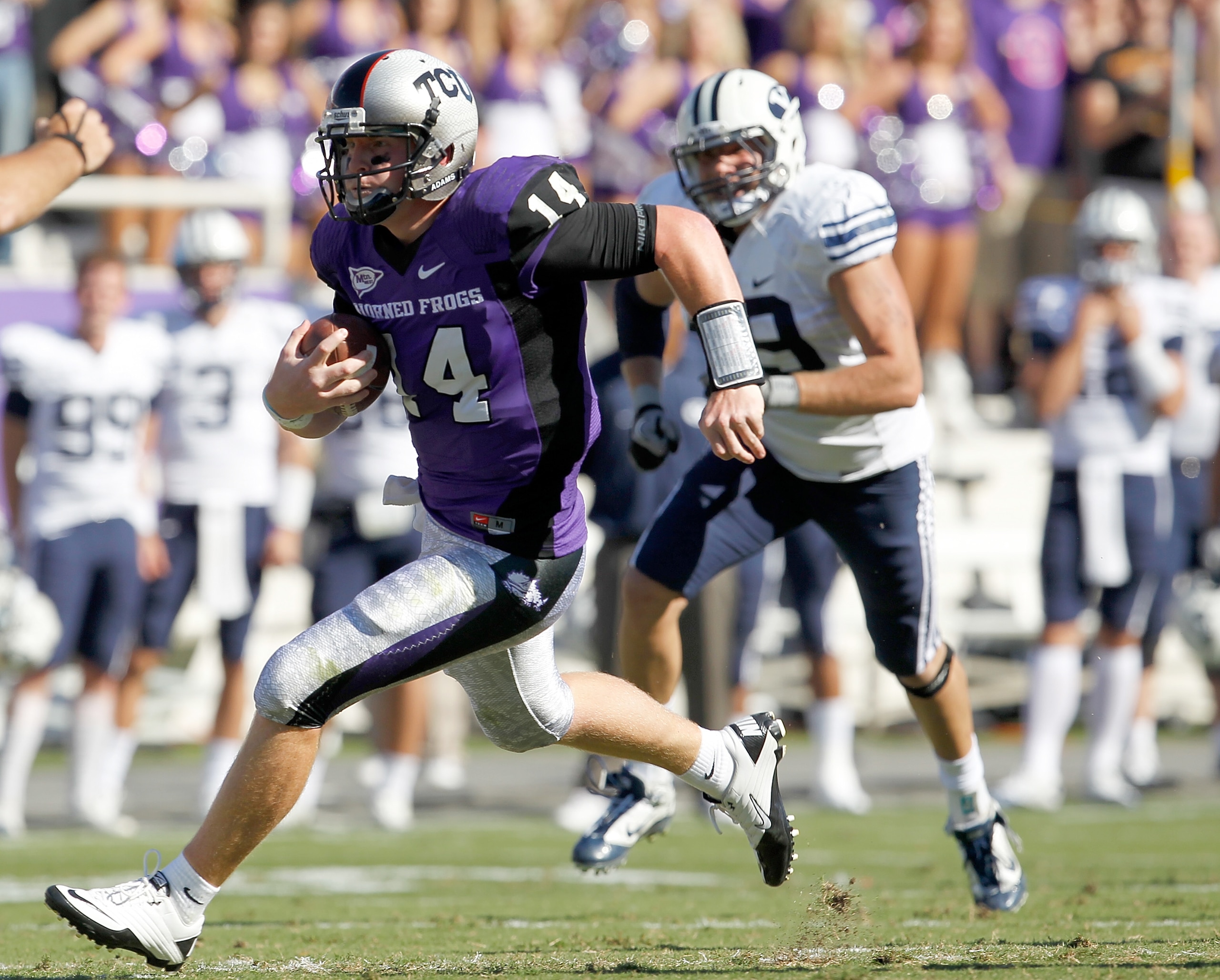 FORT WORTH, TX - OCTOBER 16:  Quarterback Andy Dalton #14 of the Texas Christian University Horned Frogs scrambles with the ball against the Brigham Young University Cougars at Amon G. Carter Stadium on October 16, 2010 in Fort Worth, Texas.  (Photo by To